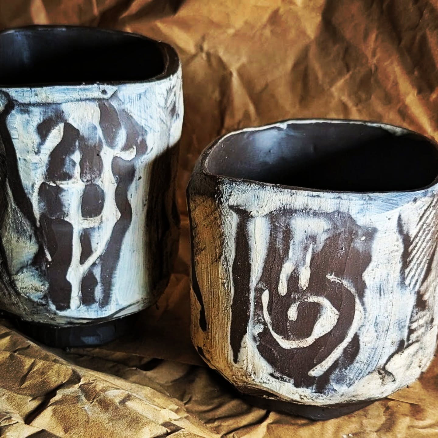 These two came together slowly by hand on a recent rainy weekend ā built, carved and layered with white slip over darker clay.
I love how the slip settles into the textures and marks, highlighting the making process.
Earthy, tactile little "totem" vessels.
Now patiently awaiting bisque firing. š
#handbuiltceramics #contemporaryceramics #ceramiccollectors #australianceramics