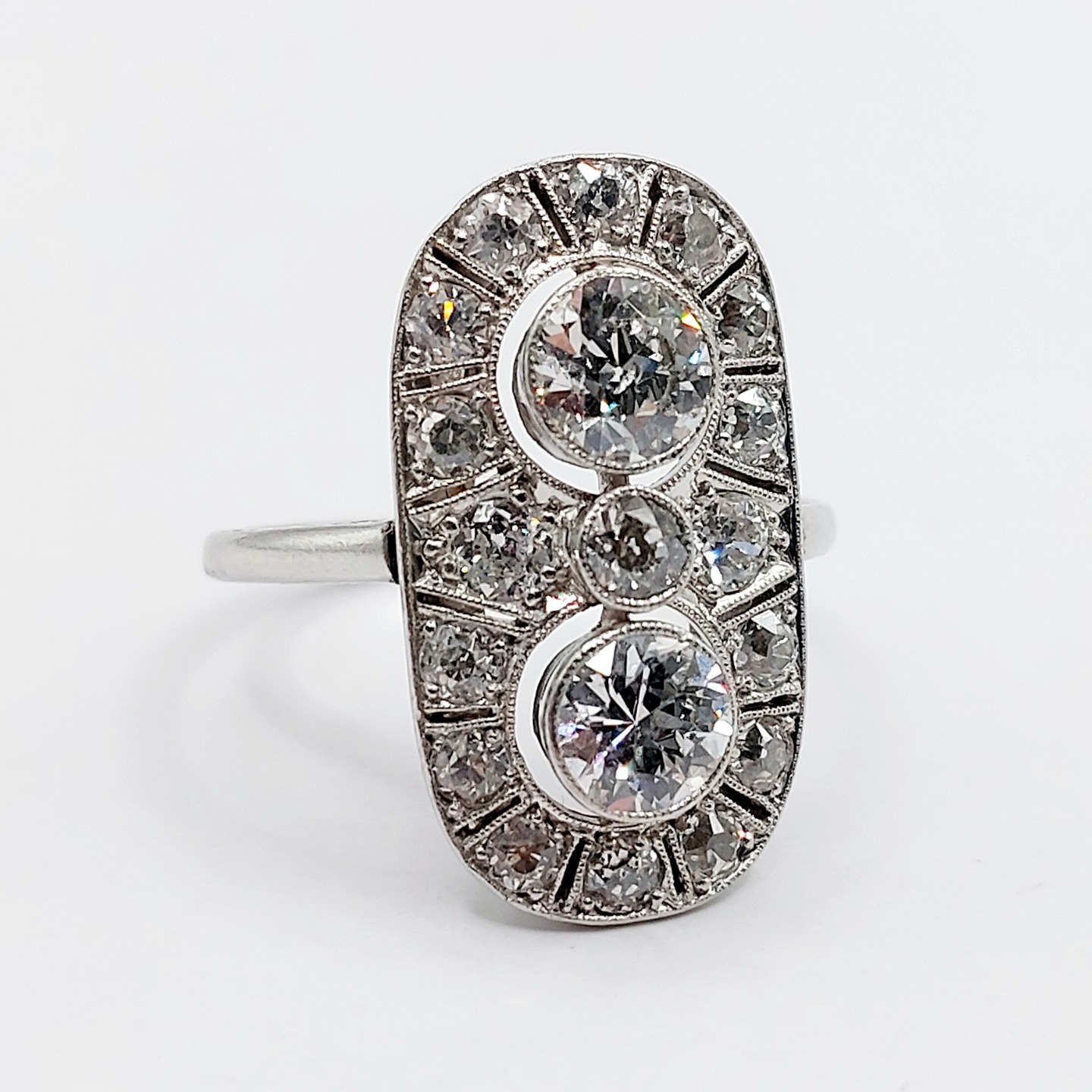 French Art Deco marquise ring Platinum set with 1.90 carats of old european cut diamonds in a finely crafted mounting (circa 1920)
PRICE : 4400€
Magnificent and rare French Art Deco goldsmith work
Size: 54 FR / 6.75 US
Weight: 7.24 g
Main diamond size (x2): approximately 5.5 mm (estimated total weight of 1.20 carats)
Diamonds in perfect condition, a few small inclusions visible under magnification
Secondary diamond size (x3): approximately 3 mm (estimated total weight of 0.30 carats)
Tertiary diamond size (x14): approximately 2/2.2 mm (estimated total weight of 0.40 carats)
Head size: 22.6 x 12.5 mm
Micro scratches from use and traces of previous resizing
Mascaron hallmark (French hallmarks)
#frenchjewelry #diamond #diamondring #antiquering #victorian #victorianring #marquisering #augustusjewels #vintagering #daisyring #daimondhaloring #tragetring #oldminecut #oldminecutdiamond