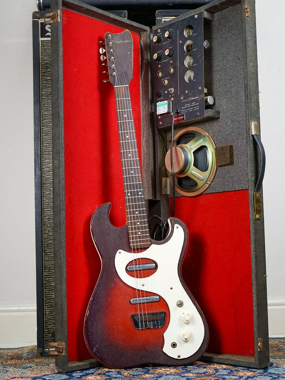 Silvertone USA model 1457 dating from 1964, complete with its original case with built in amp.
Sears’ all-in-one solution for the burgeoning guitarists of the 60s, complete with a tiny valve amp built right into the case! It even has a tremolo sound and while not the loudest amp in the world, sounds very sweet. And it’s fully serviced (but being USA-made, will require a step-down transformer).
I’m asking a mere £750 on my site for this one - worth it just for the guitar in my opinion (this being the superior 2 pickup, full scale version - offers a lot more in the way of tone than the 1-pickup version).
Get in touch if interested!