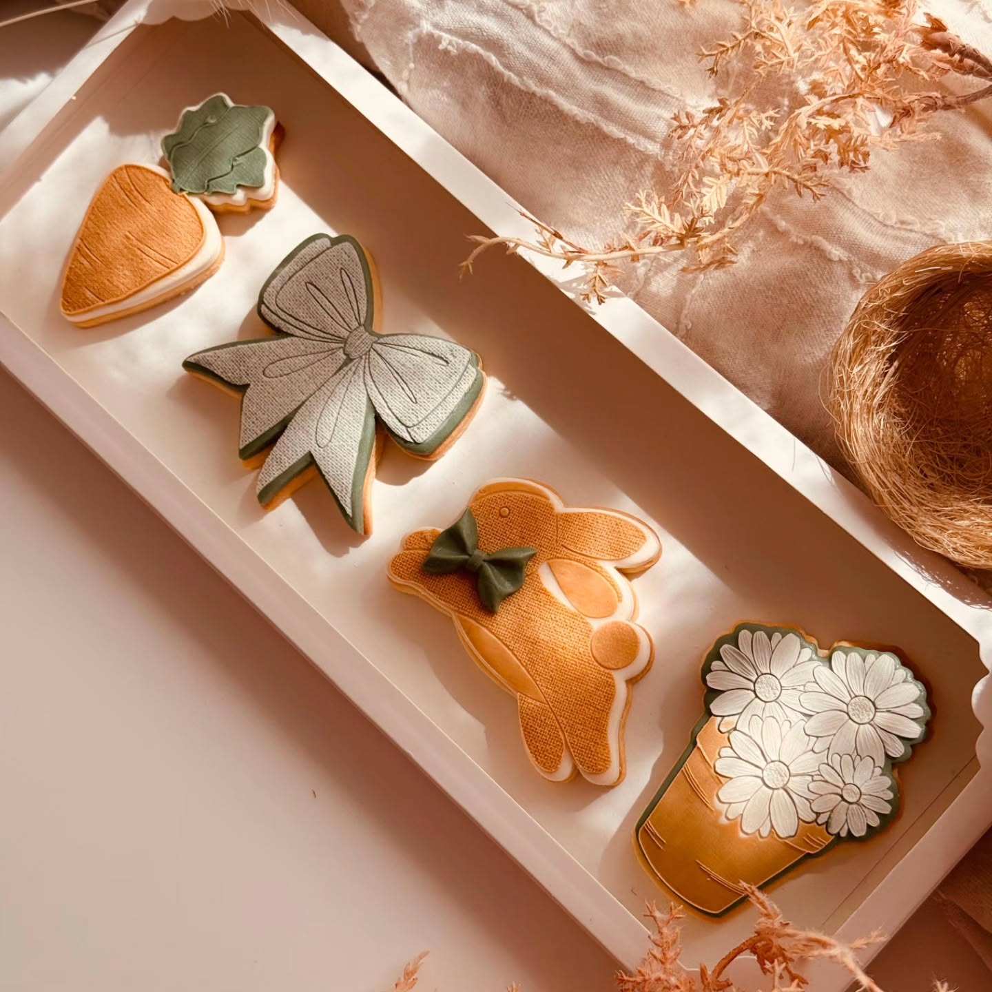 There’s something I love about pieces that don’t belong to just one season.
While these designs may feel a little Easter-inspired at first glance, the truth is they’re far more versatile than that.
A sweet bunny becomes a baby shower cookie, a carrot finds its place in a garden-themed set, the bow works beautifully for birthdays or gifts, and a jar of flowers suits almost any occasion.
This is always at the heart of how I design stamps and cutters.
Pieces you can return to again and again, not just once a year.
And of course, presentation matters just as much as the cookies themselves. Beautiful packaging elevates the entire experience.
It turns a simple set of cookies into something that feels thoughtful, giftable and a little bit special before the box is even opened.
Because when something looks beautiful from the very beginning, it already feels more valuable.
Quietly timeless. Wonderfully versatile.
Stamps and Cutters @vintagesugarcraftbycatgerine
Packaging @biskitboxau
Creative production and photography by @crumbswithlove
#bakingbusiness
#cookiedecorating
#cookiedesign