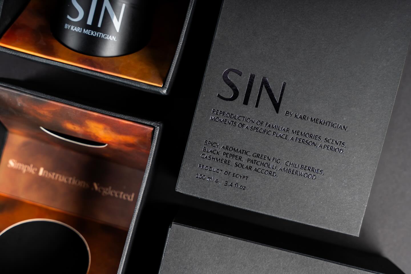 Custom packaging for SIN Perfume by @analogue.olfactory created by @karimmekhtigian , featuring dapper black boxes finished with impeccable details that embody pure luxury.