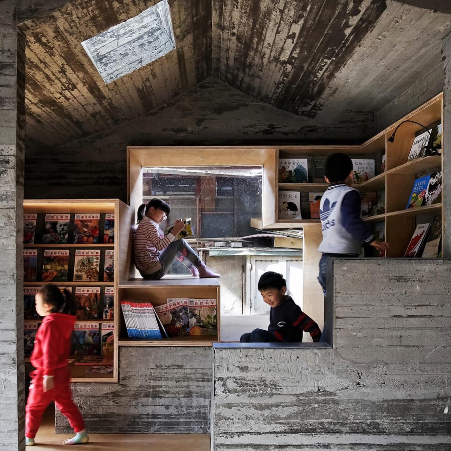 Nestled into a residential compound, sits a beautiful 9sqm children’s library designed by ZAO/standardarchitecture in the centre of Beijing. The small library space has been carefully designed into the existing urban context, providing a small refuge for children within the residential community. A series of playful staircases and small structures is arranged around a large tree, providing viewing platforms for children to climb into. The reading nooks become hiding spaces and ‘secret caves’ that provides moments of refuge and play for both children and the elderly. The children’s library sits alongside a community art centre and is free and open to the neighbourhood.
As is noted by the architects “ A child may stop by after school, pick out a favourite book, and read in his little niche before getting picked up by the parents. Or the kids may climb up onto the roof, sit in the shade, and engage in a cosy conversation with the elderly in a familiar but new space.” This series of playful structures exemplifies how the built environment can enrich a communities live, creating opportunities for play, replection and connection.
.
.
Project name: Hutong Children’s Library and Art Centre
Location: Beijing, China
Architect: ZAO/ standardarchitecture
Photos: ZAO/standardarchitecture & Shengliang Su
.
.
.
#citiesforplay #playfulcity #childfriendlycity #play #learningthroughplay #urbandesign #placemaking #publicspace #urbanplanning #citymaking #urbanchildhoods #citylife #urbanista #planning #citylab #citiesforpeople #playmatters