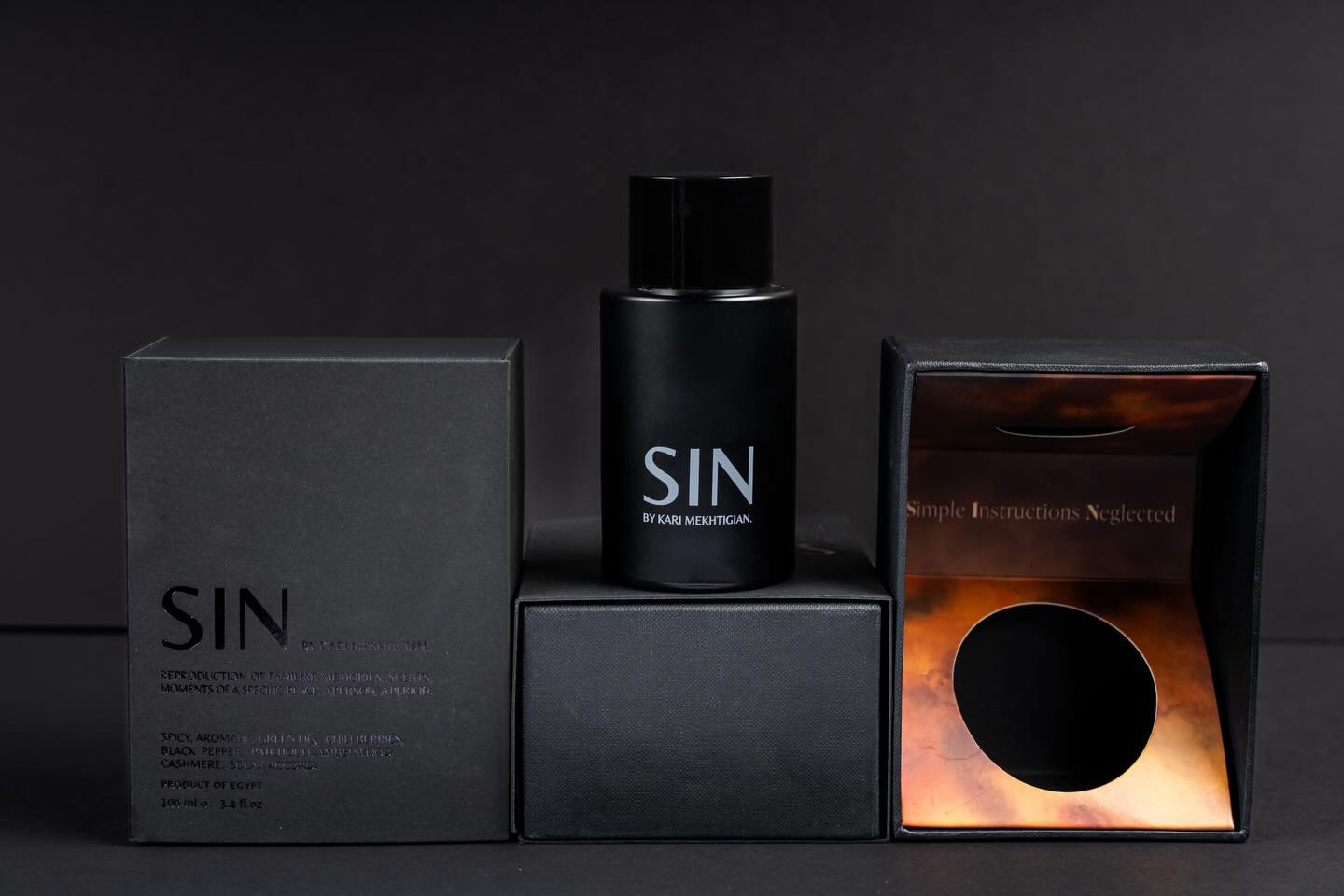 Custom packaging for SIN Perfume by @analogue.olfactory created by @karimmekhtigian , featuring dapper black boxes finished with impeccable details that embody pure luxury.