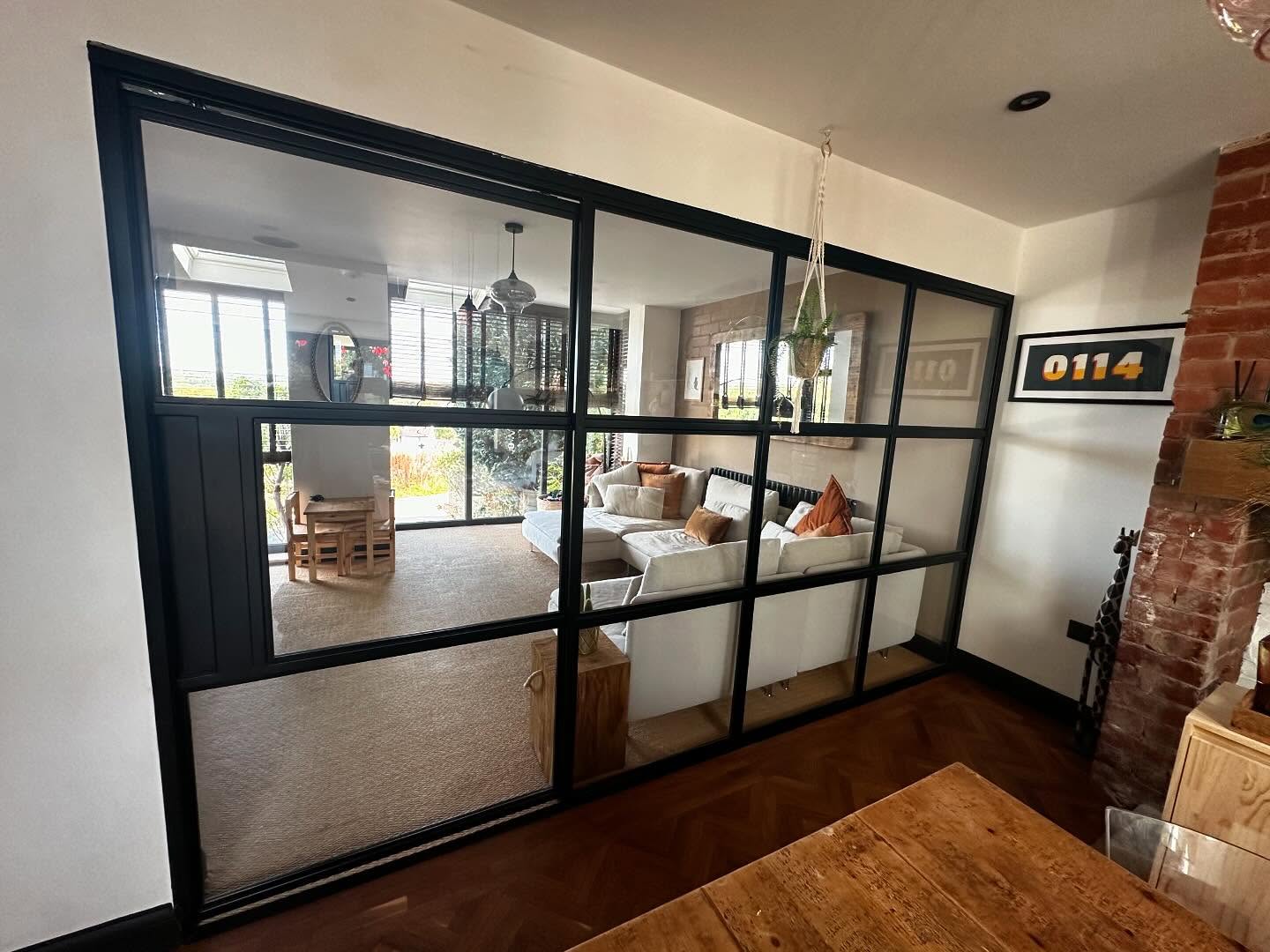 Custom made glazed partition with sliding door