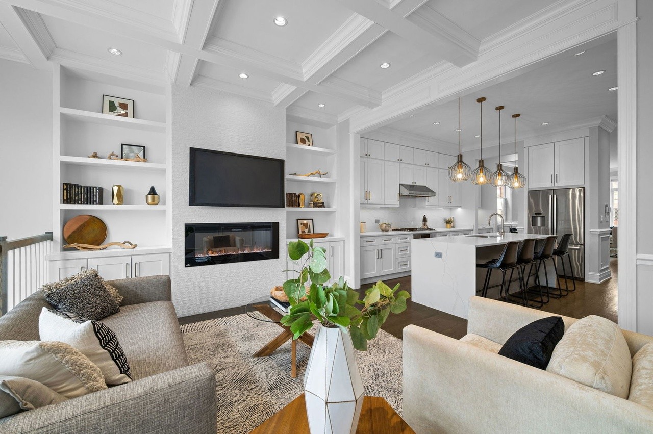We carved out a spacious seating area in this open floor plan home to show flowing conversational and lounge opportunities. #luxe #chicago #chicagorealestate #havenhomestager #chicagohomestaging #stagingworks #stagingsells #staging #homestaging