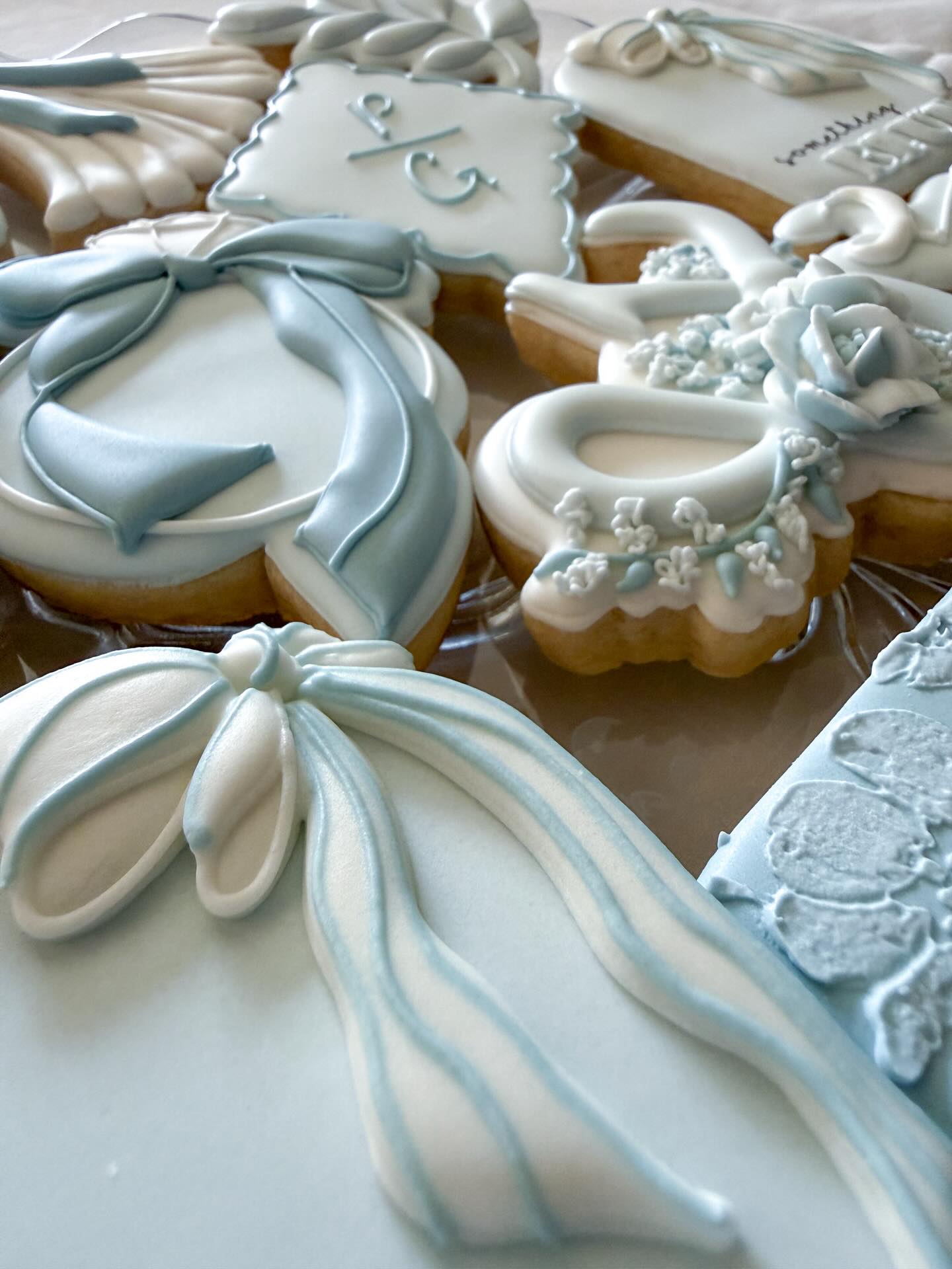 Cookies for this "Something Blue Before I Do" bridal shower included all the pretty things in soft blues ... from rings and bows to flowers and wedding gowns and more! I can't pick my favorite. Which one is yours?
PS: This set includes a cookie cutter that I bought when I was just starting out. Any guesses which one it might be?
#decoratedsugarcookies #customcookies #nebraskacookier #nebraskabaker #weddingshowercookies