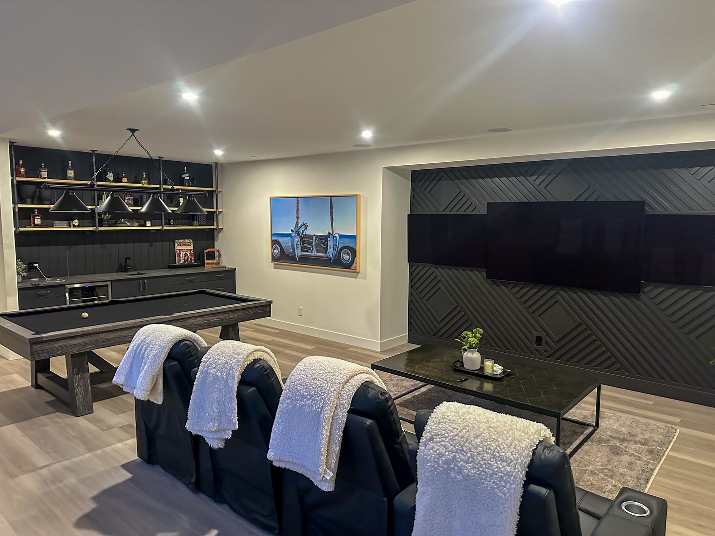 Custom basement entertainment lounge.
Featuring a built-in bar, media wall, and billiards area — designed for hosting and unwinding. #ironrosehomes