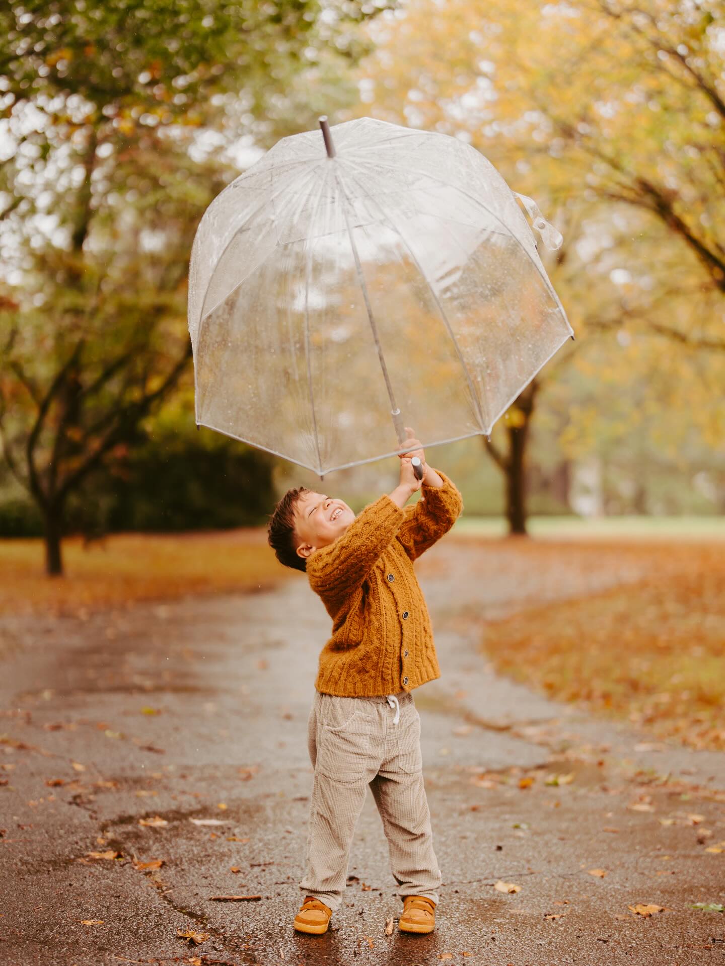 If you’ve been around for a little bit, you know how much I love a rainy session. I swear I was made to live in Washington. I thrive in the cool rainy weather. The clear umbrellas come out and it’s time to dance in the rain. New England weather can be so unpredictable that if you embrace the liquid falling from the sky we can create some really fun memorable photos!
