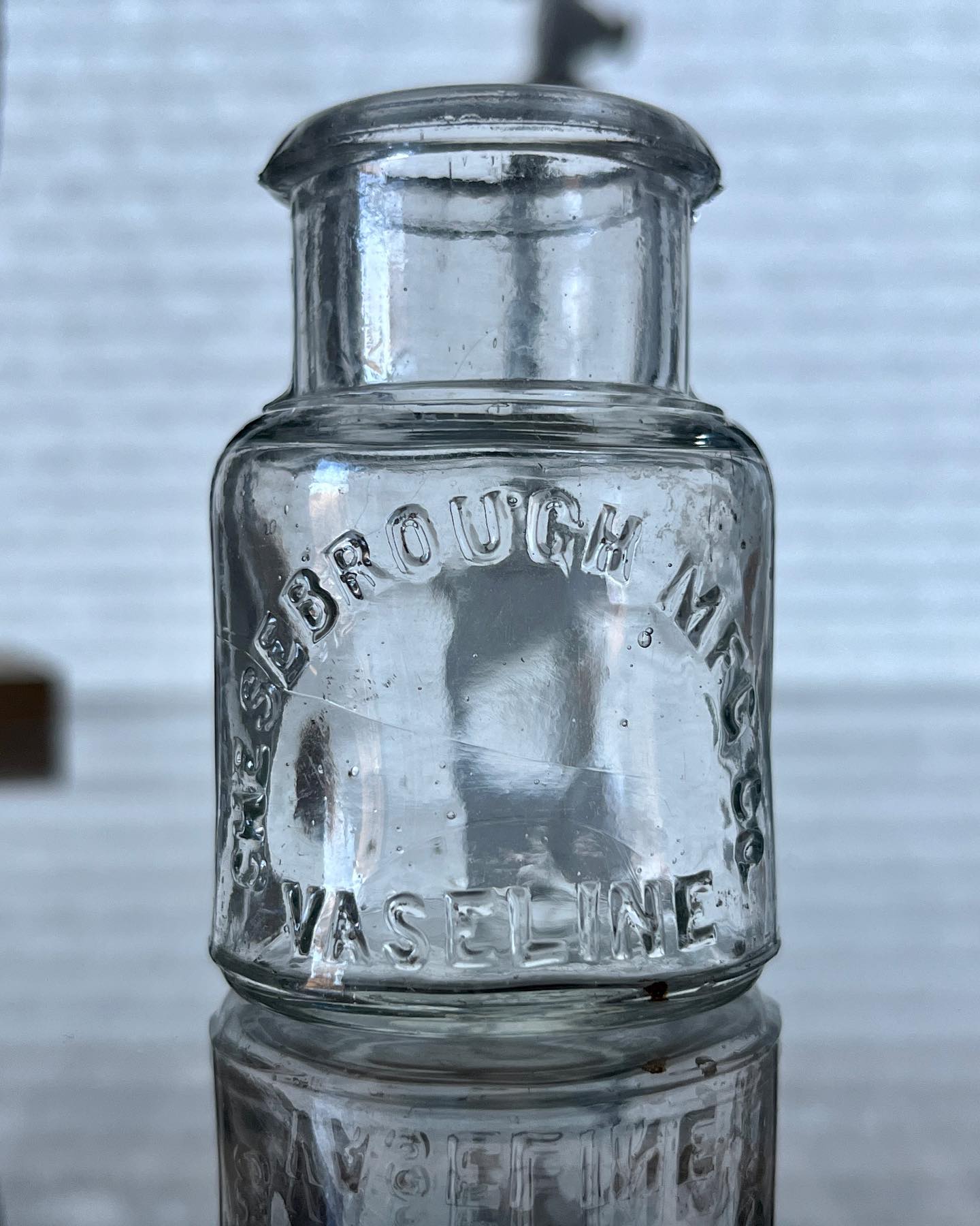 1895 Chesebrough Vaseline Jar
At the age of 22, Robert Augustus Chesebrough was already an established chemist, experienced in the study of petroleum. In observing an oil operation in 1859, Chesebrough noticed that workmen were applying “rod wax” – a viscous, sticky, black substance that adhered the drilling rods – to cuts and bruises because it made the wounds heal faster. He took samples of the rod wax back to Brooklyn for study and eventually created a clean product that he called “petroleum jelly”.
Bill Lockhart (2015), suggests that Chesebrough originally filled all the containers in his home with his new petroleum jelly, then began using his wife’s vases to hold the overrun. On a whim, he combined the word “vase” with the medical suffix “line” to form the new name for his product: Vaseline.
Obtaining a horse and a wagon, Chesebrough loaded up with thousands of one-ounce sample bottles and set out for New York, giving out a bottle to every person on the route, occasionally stopping at country farms along the way. The last link in each area was, of course, the local druggist, who would inevitably fill the demand created by the samples.
One of history’s first giveaway campaigns was a success, and in 1878, Chesebrough received trademark No. 6,041 for the word “Vaseline” and one year later, his product was available nationwide.
This small promade-style jar is one of the earlier variations. It is machine-made with a distinct “V” shaped groove on the upper shoulder with extremely sharp and crude edges present in the glass at the mold seam line. Bill Lockhart dates this bottle to either 1895 or 1896.
.
.
.
.
#collection #bottlecollection #bottledigging #vaseline #bottlehunting #lostandfound #pickers #antiques #historyhunter #bottlecollectors #antique #treasurehunting #history #bottlecollector #antiquebottle #archaeology #bottlecollecting #finditpickitup #treasure #adventure #treasures #detecting #savinghistory #dirtfishing #travel #explore #buriedtreasure #bottlesandbits #treasurehunter #artifacts
Source: Bill Lockhart