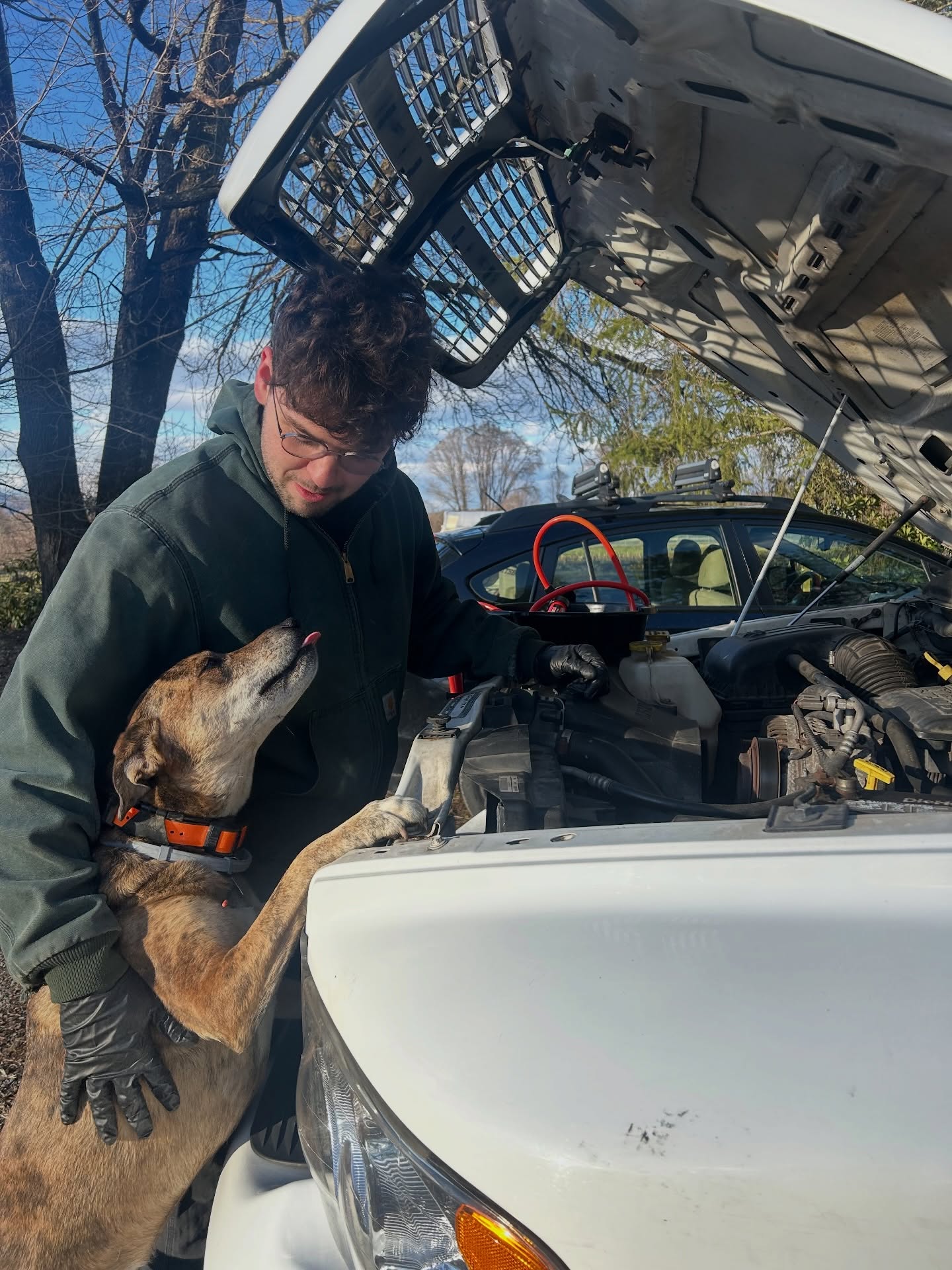 Two mechanics working on the farm truck today.