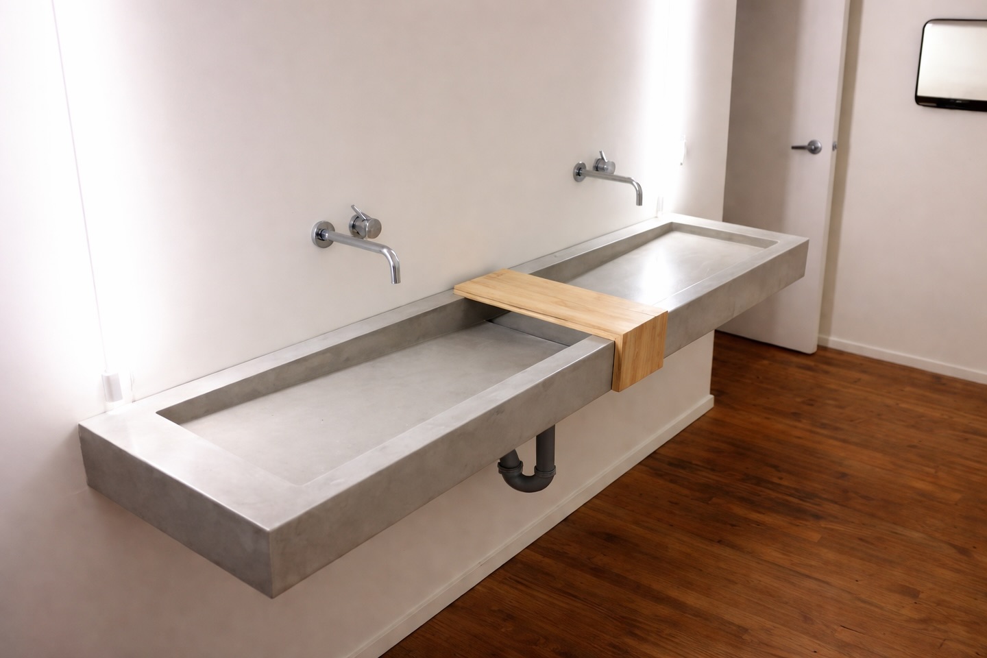 Floating concrete sink with integrated ramp basins, fabricated and installed by our team.
Paired with a warm natural wood shelf to soften the industrial concrete and create a balanced, functional detail between the two stations.
Custom concrete allows us to design pieces that are both sculptural and practical — built specifically for the space they live in.
Handmade in Toronto.
#ConcreteDesign #FloatingSink #CustomConcrete #ArchitecturalConcrete #interiordesign
