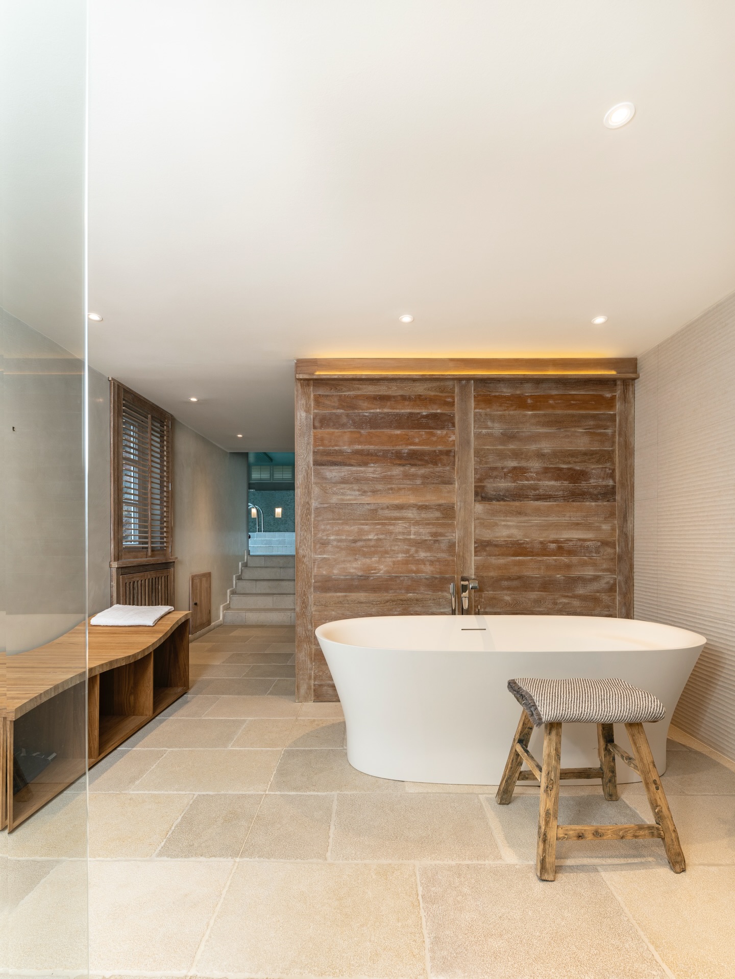 Soft, grounded, and deeply calming
this private spa space unfolds as a quiet retreat within the home.
Warm wood surfaces wrap the sauna in a sense of intimacy and craftsmanship, while natural stone floors add a tactile, earthy balance. The transition towards the indoor pool opens up the space, where cooler tones and soft reflections create a gentle contrast to the warmth of the sauna.
Carefully placed lighting enhances the atmosphere throughout -subtle, indirect, and never overpowering - guiding the eye and shaping a serene, immersive experience from heat to water.
A space designed not just for wellness, but for slowing down, disconnecting, and feeling completely at ease.
It’s all about the feeling.
.
.
.
.
.
#luxuryinteriors
#interiordesign #wellnessspace #saunadesign #spaathome timelessdesign