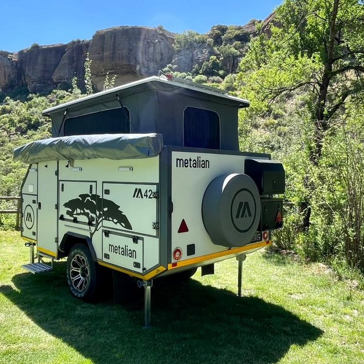 Introducing the Metalian caravan!
Features:
- Hot dip galvanized chassis - FEA (Finite element analysis) certified.
- Double-eye leaf spring suspension with overload blade.
- Vertically positioned shock absorbers.
- Progressive rubber bump stops
- 30mm PVC foam insulated body panels.
- High strength 5 series aluminium panel skins.
- Robust 2mm thick aluminium profile frame.
- Super lightweight construction
- Caravan window with integrated blind.
- Luxurious mattress and headboard.
- Overhead reading lights.
- 150 litre internally fitted LLDPE water tank.
- Polycotton canvas with YKK zips.
- Victron electrics.
Contact sales@metalian.co.za for more info