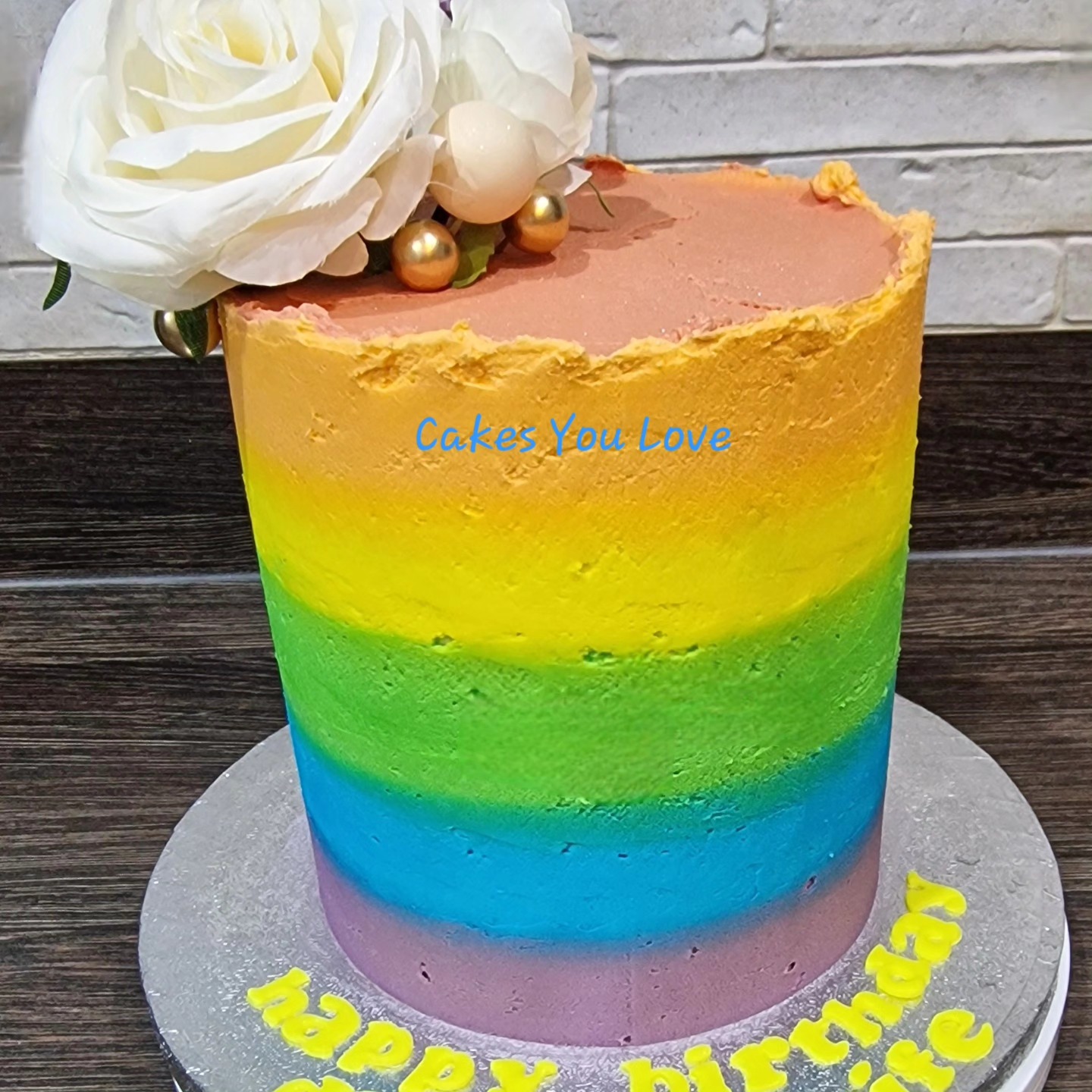 A rainbow vanilla cake filled with vanilla buttercream. Faux flowers for decoration.
Leftovers were enjoyed as well. It's nice to see what the inside of the cakes looks like. I rarely get to see them cut lol
