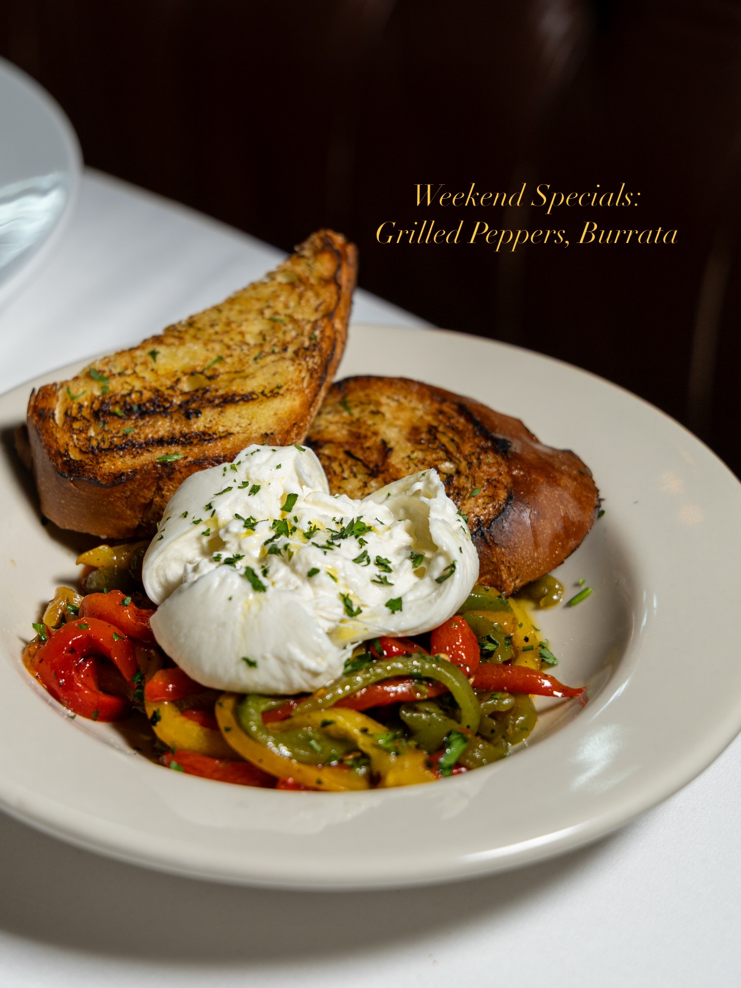 Chef Hernandez is leaning into comfort this week — the Ossobuco di Maiale is a white wine-braised pork shank over parmesan polenta that’s going to turn heads, and honestly the whole lineup has that slow-cooked, comfort energy that works right now.
Grilled Peppers Burrata — Wood-grilled mixed peppers and onion served with homemade toasted bread and fresh burrata cheese. Simple components, but the wood grill changes the peppers entirely.
Halibut Puttanesca — Wood oven roasted halibut with a spicy tomato sauce built on anchovies, olives, toasted garlic, and white wine, served with fingerling potatoes. Puttanesca is a sauce that originated south of Tuscany, but the wood oven roast on the halibut is pure Siena.
Ossobuco di Maiale — White wine-braised pork shank with parmesan polenta and pork jus. This is the kind of dish that doesn’t exist at most Italian restaurants in Austin — low and slow, rich without being heavy.
Shellfish Risotto — Maine lobster, crabmeat, shrimp, mussels, and calamari in a butter persillade with Fresno chilis and white wine. If you’re a shellfish person, this is the one.
Pro tip: Start with the Grilled Peppers Burrata as a table share — the warm burrata and charred peppers set a good pace before the heavier entrées, and it pairs well with a glass of Vermentino if you want to keep things light up front.
📍 6203 N Capital of Texas Hwy, Austin, TX 78731
📞 (512) 349-7667
#ItalianFoodAustin #SienaAustin #TuscanCuisineATX #AustinEats