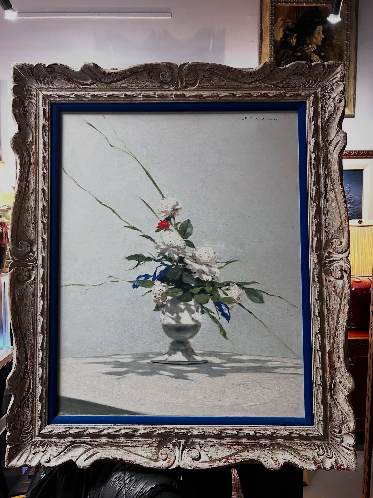 A moment of quiet elegance ✨
This luminous still life by André Gisson captures everything we love about his work — soft, romantic florals arranged with effortless movement, set against a light-filled backdrop that feels almost like morning air.
The composition has that signature Gisson ease: delicate whites, a touch of vivid red, and those graceful, reaching stems that bring the whole piece to life. The silver vessel grounds it beautifully, reflecting just enough light to anchor the scene.
Framed in a richly carved vintage frame with a striking blue liner, it’s a piece that feels both classic and fresh — perfect for a serene interior.
Available at the shop in Dundarave
#andregisson #frenchstyle #stilllifepainting #artcollector #interiorstyle vintageart fineartforsale westvancouver ambleside artlovers timelessstyle