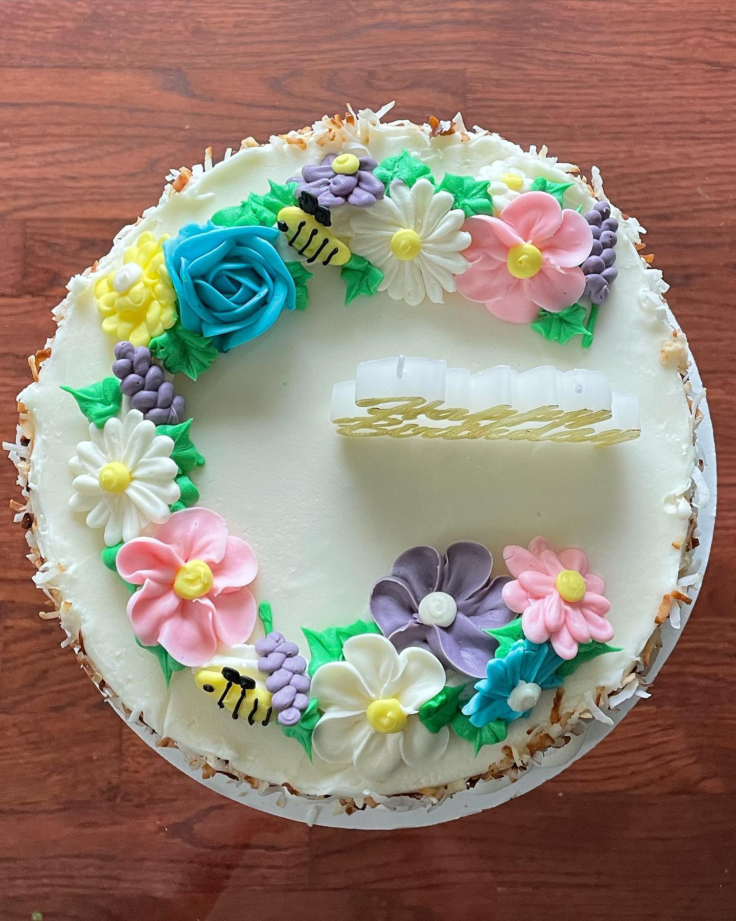 The perfect birthday cake for spring birthdays ☀️🌷 Featuring a southern coconut cake, pastry cream filling and a tangy coconut cream cheese buttercream.