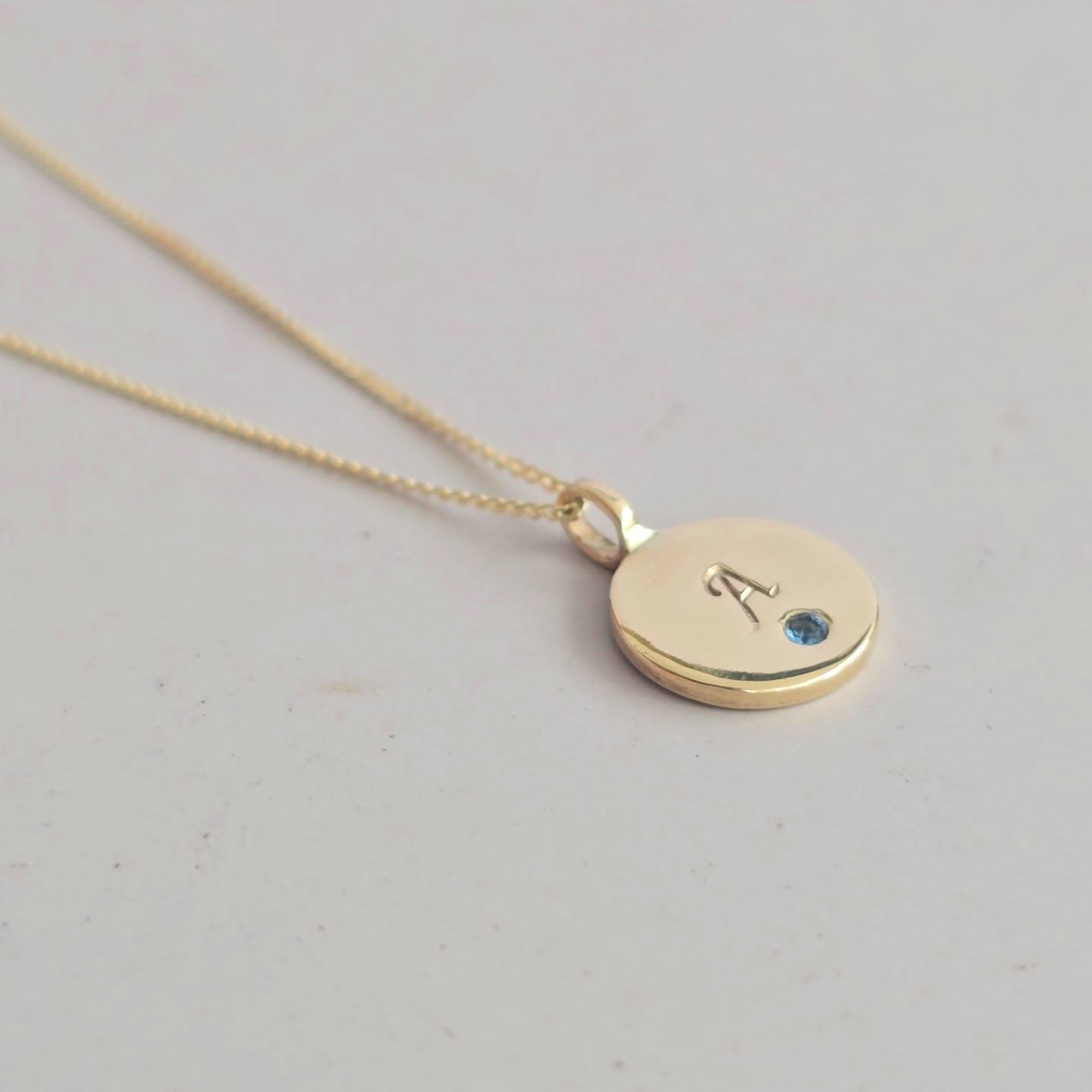 I love this 9ct gold initial pendant, set with a delicate aquamarine. Each letter is hand-stamped using a traditional metal stamp and hammer—something that always makes me a little nervous when working with gold, as it truly is a one-hit moment ✨💎