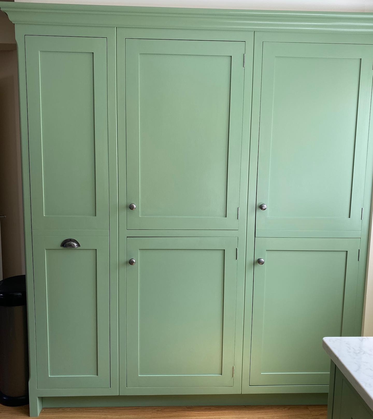 This row of cupboards is the storage dream. Painted in breakfast room green and decorated it with simple antique pewter handles. How organised would your kitchen be with this! A long pull out pantry cupboard, spacious cupboards and a fully integrated fridge freezer. #jharriskitchens #handmade #bespoke #kitchens