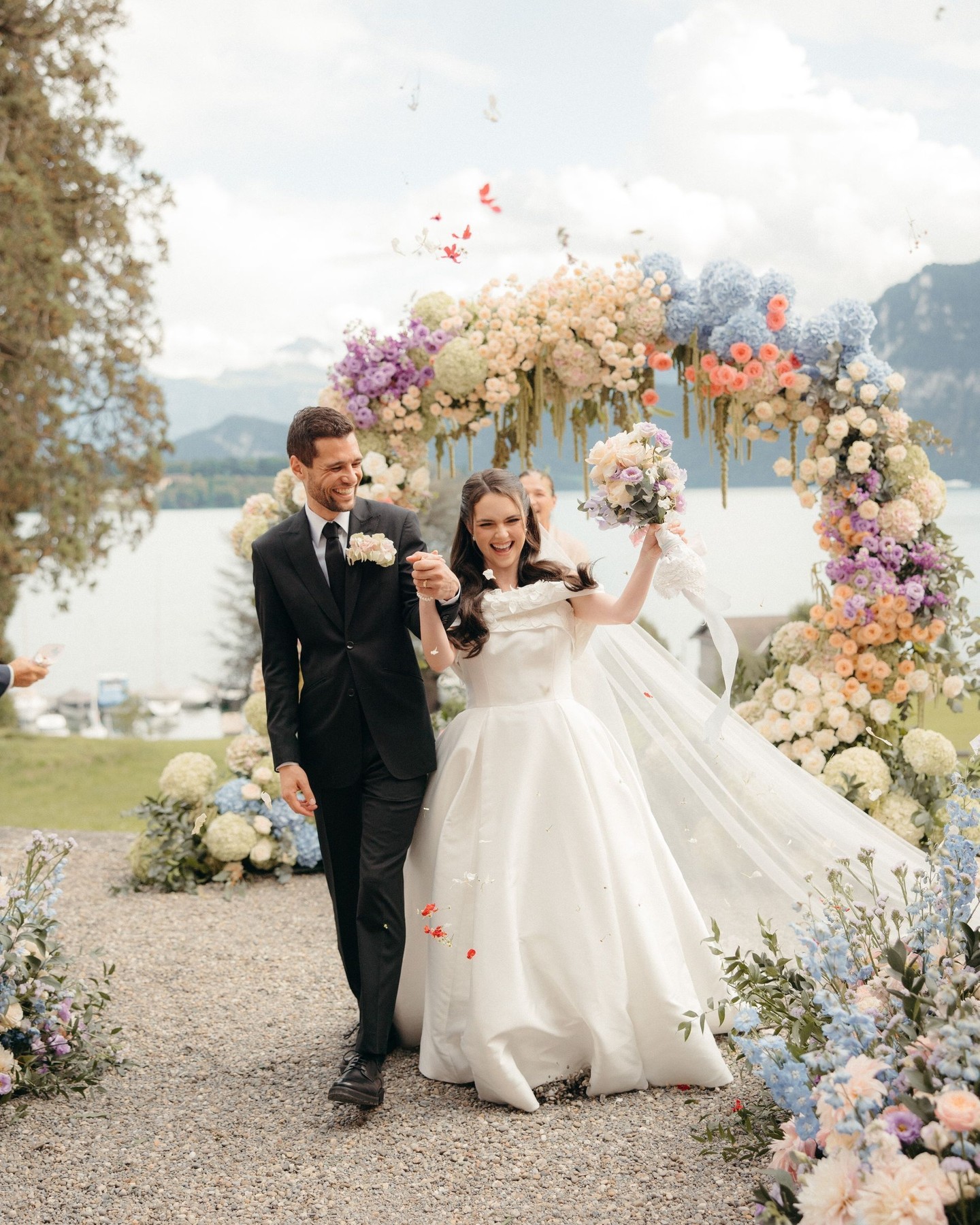 Joy, movement, and that just-married kind of glow.
These are the moments that remain long after the day is over — spontaneous, emotional, and entirely full of life.
A celebration should feel as beautiful as it looks.
PLANNING, PRODUCTION & FLORAL DESIGN: @gaeadesignevents
WEDDING VENUE: @st_charles_hall
PHOTOGRAPHY & VIDEOGRAPHY: @paramonova_movies
HAIR & MAKE-UP: @julia__dittrich
CATERING: @gamma_catering
CAKE: @pandemiel.ch
RENTALS: @options_ch
STATIONERY: @tennhensdesign
CUSTOM TABLECLOTHS: @prints_by_fi
STRINGS: @musaico_DJ: @deindj.ch
BEHIND THE SCENES VIDEO: @switzerland_dronefilming
#GAEADesign #JustMarried #WeddingMoments #LuxuryWeddingPlanner #DestinationWedding