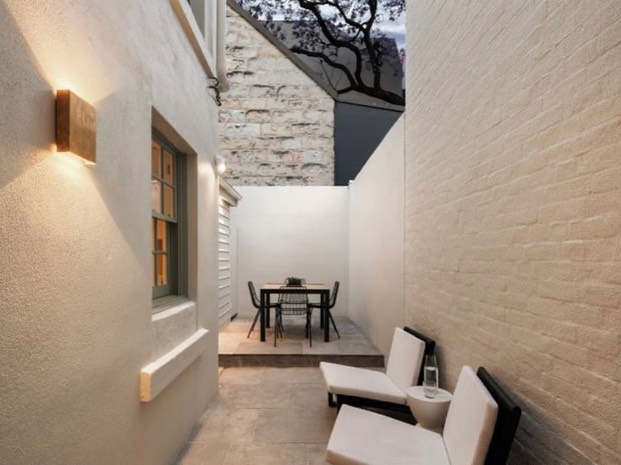 Travertine crazy paving adding the finishing touches to this tranquil courtyard