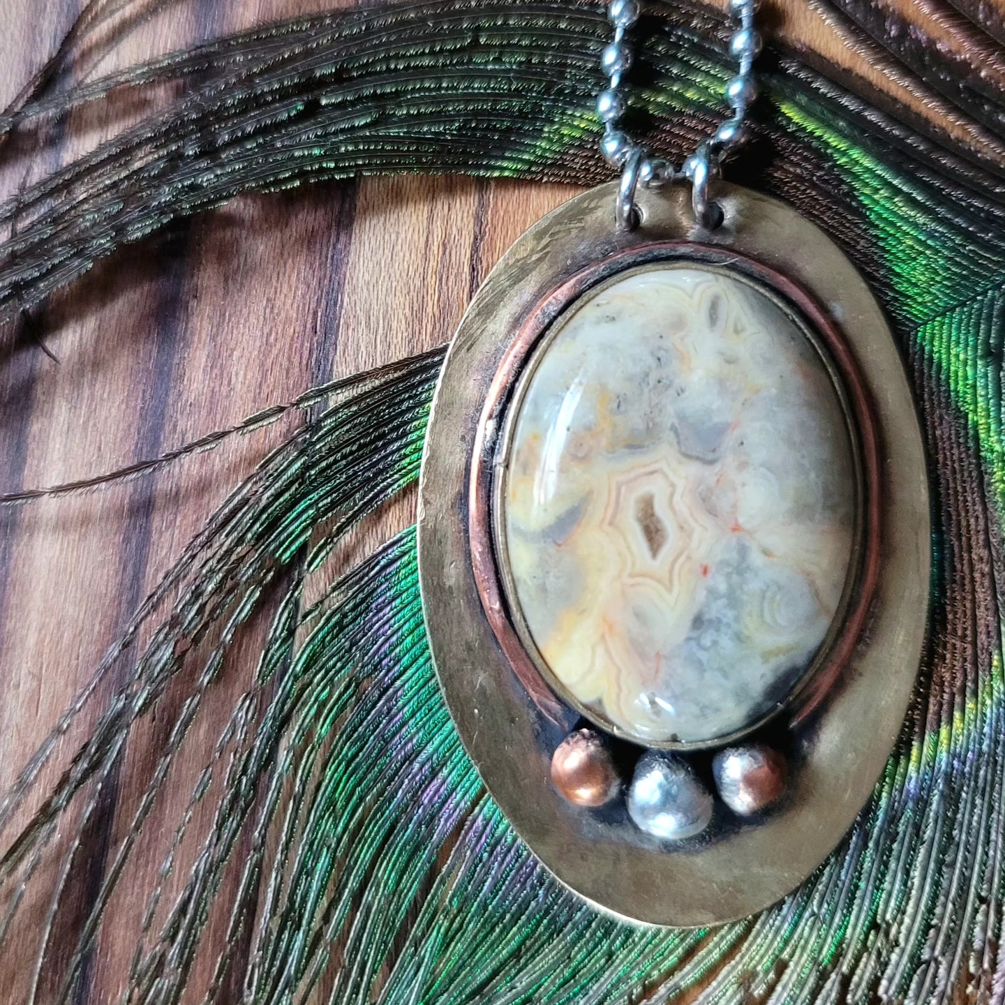 Crazy Lace Agate Pendant • Brass with Copper & Silver
#metalsmith #pendant #jewelry #fineart #handmade #metalsmith #mountainjewelry #necklace #smallbusiness