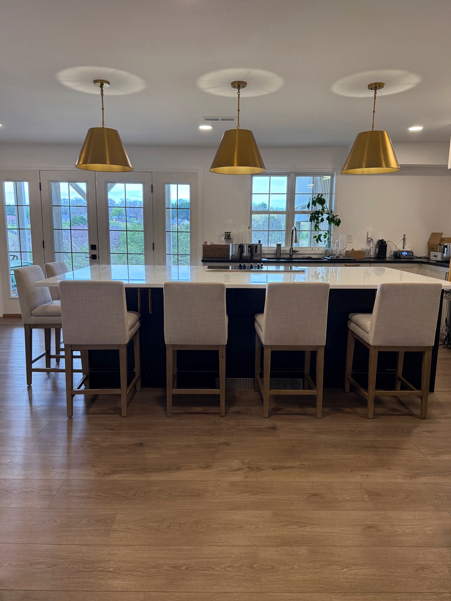 It’s been 8 months in our new work space. 🕯️✨🍺 I still have to pinch myself that I get to make candles here. We worked with a designer to make sure the counters could handle hundreds of hot candles and fragrance oils, that drawers were at a functional height for scooping wax out of 50 lb boxes without wrecking your back, and it needed to be laid out so Arik could be brewing while I’m candling without running into each other.
After living in it for 8 months, it honestly functions so well. Arik brews with BCHB (Blount County Home Brewers) and does a lot of batches for local festivals and breweries, and this space has worked really well for him too. He has space for 3 beers on tap, along with a fridge that houses all his beer and my Diet Coke. No small feat. 😂 Even the storage feels glamorous to me. We will probably add a backsplash that can handle hot wax and beer splatter someday, but it works well enough without for now. Absolutely over the moon with how this space turned out.