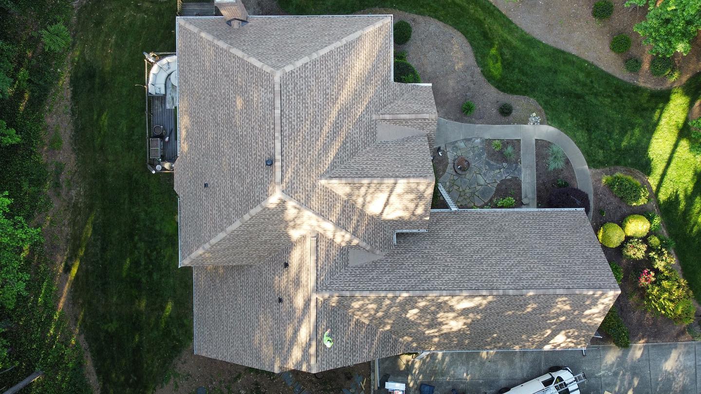 Swipe ➡️ to see the before & after of the re-roof with GAF Timberline HDZ shingles in Shakewood Color, new 6” K-Style Gutters, with Xtreme Gutter Guard system in Mooresville, NC