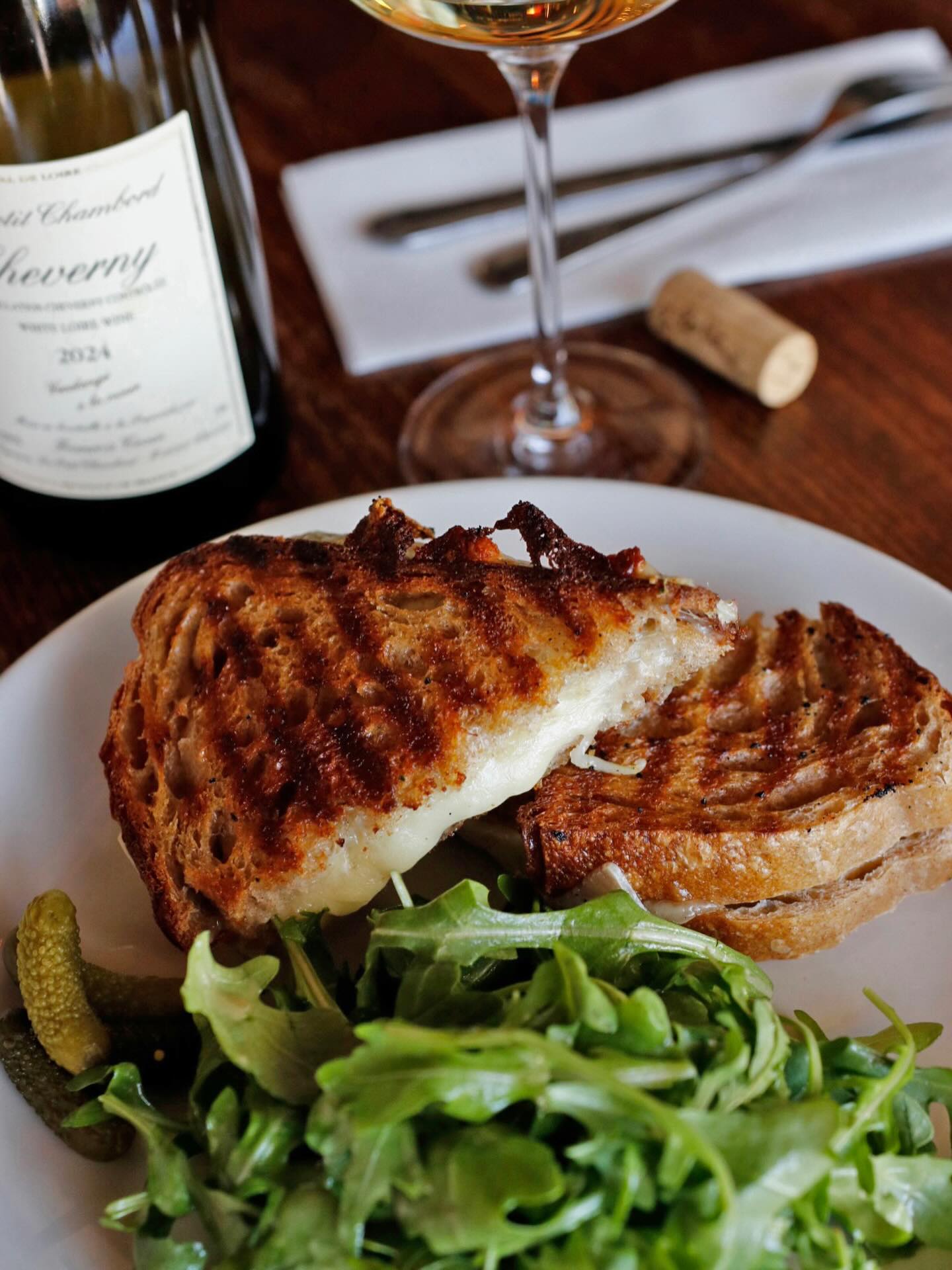 Our grilled cheese is loaded with gruyere and provolone and grilled on sourdough @brandons__bread! Served with arugula and cornichons, you have the option to add jamón ibérico! 😋 See you this afternoon.