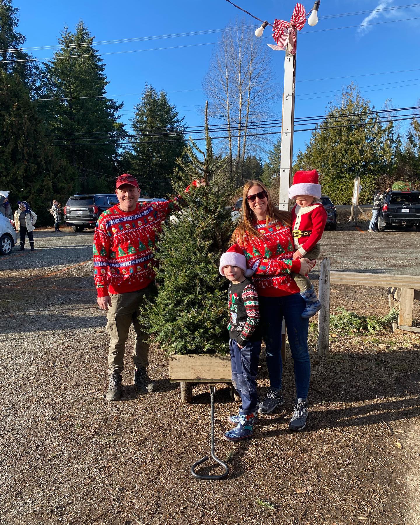 Here’s a few pics of our more “interesting” tree customers today, including the family that cut the 18 ft Douglas Fir that Al estimates weighed about 500 lbs!