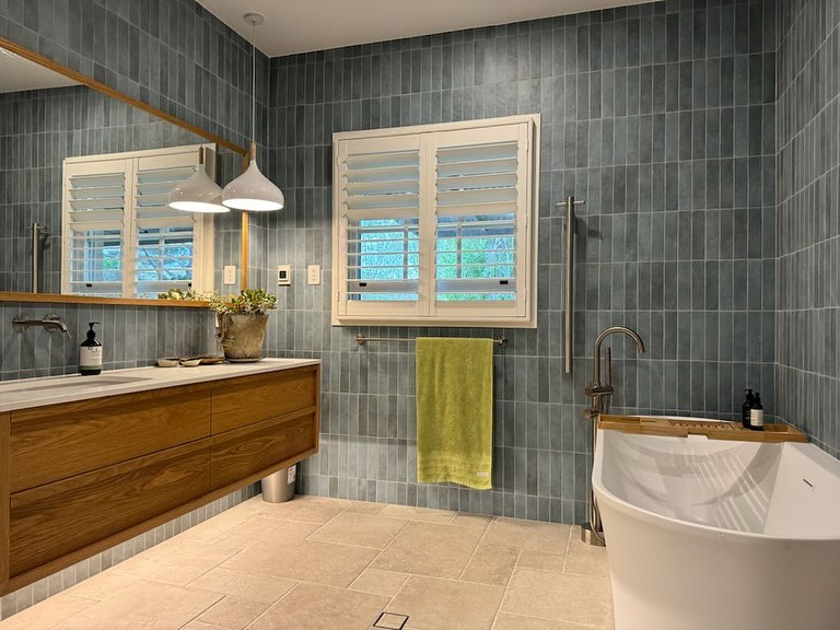 So thrilled with the transformation of this expansive bathroom for my gorgeous Berrima client. Relocating the bath & enclosing the window on the back wall created the opportunity for more storage & how fabulous are those tiles? Swipe right for the previous incarnation! Gorgeous vanity in handcrafted solid timber from @loughlinfurniture