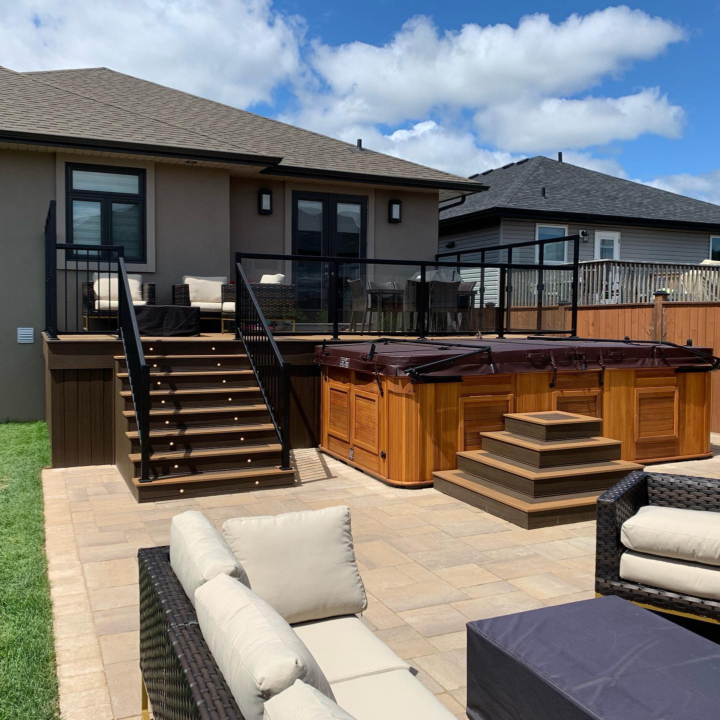Project complete! It was fun watching this back yard transform, even though we had to wait a lot for materials(thank-you covid). We installed trex decking with aluminum/glass railings. Two sides have a higher sides, creating more shelter from the wind. The patio area is unilock Windermere smooth pavers, with quarry stone for the planter. #backyardoasis#readytoparty#beforeandafter#curbappeallandscaping