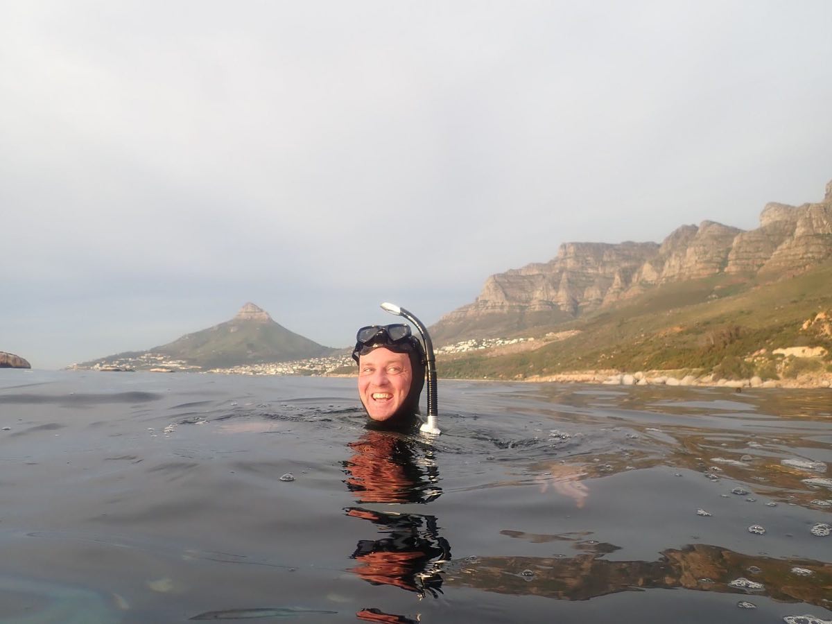 I have solved the mystery!
Chronic goggle and mask leak has been a big problem for me. I often abandon dives early, and curiously, always when conditions are best. They leak more the deeper I dive and always just as I see amazing things (like a weird blue ray thing yesterday). With swimming, they always leak just after stopping to look at the view.
I’ve tried three brands of dive masks and five different swim goggles, and every suggestion on Google. This picture was taken yesterday, right as I was considering quitting because I was battling so much… Guys, wait for it…
IT’S BECAUSE I SMILE SO MUCH IN THE WATER MY CHEEKS MOVE THEM OUT OF POSITION!