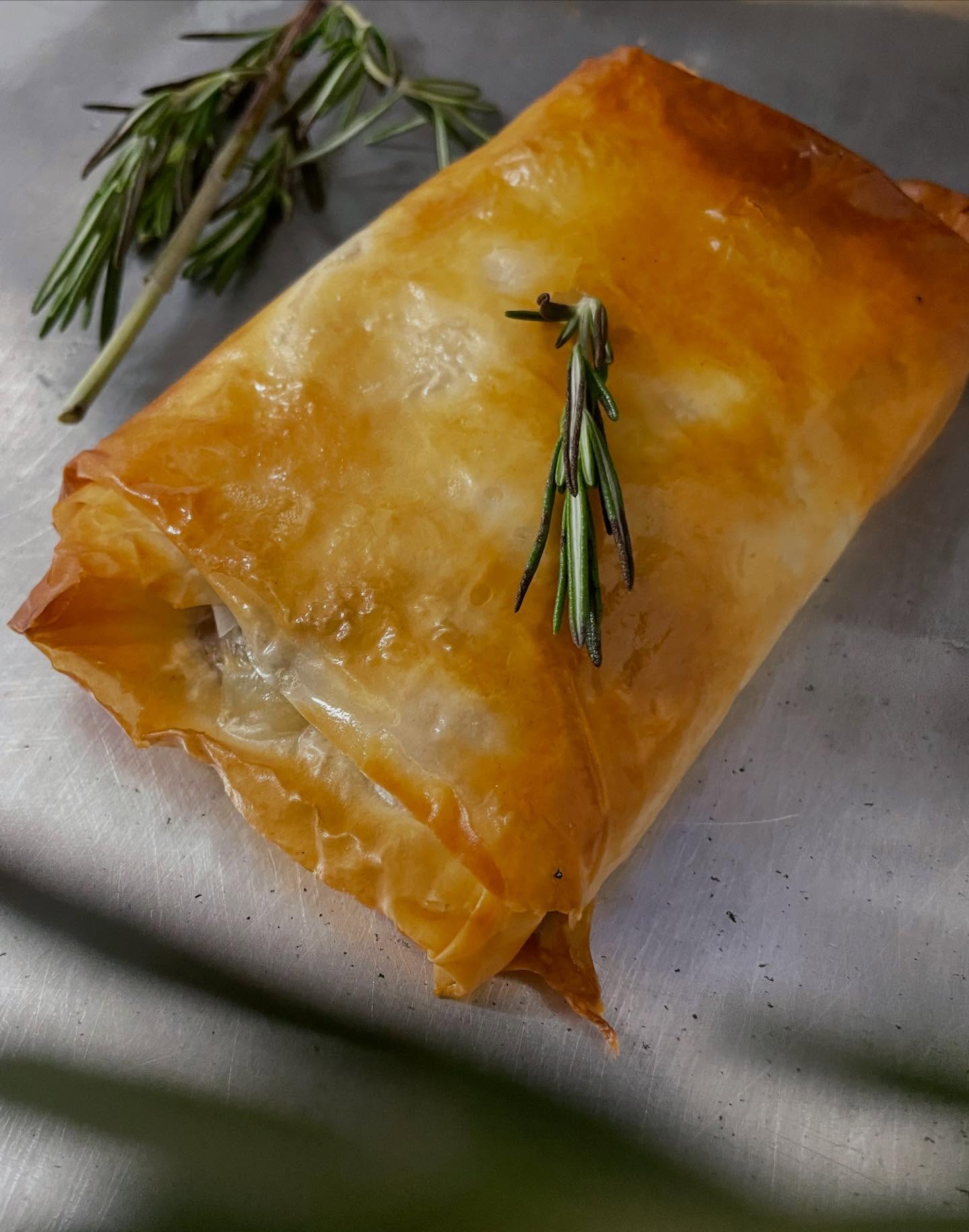 Main Street’s Cotopita! Sautéed Mushrooms, caramelized onions, roast chicken thighs, fresh rosemary, Parmesan cheese, whipped eggs & a little salt n pepper all wrapped up butter painted phyllo pastry and baked in the oven! Mmm mmmm mmm.
.
.
.
.
.
.
#freshbaked #goinggreek #goodeats #nelsonbc #since1983
