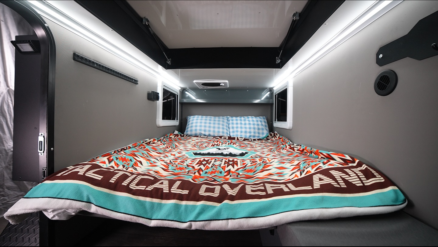 Dialing in your sleep setup has never been easier 🙌
The Overlander is designed to go from day mode to full bed in minutes, with a smart, space-saving layout that just makes sense after a long day on the trail.
Inside, you’ve got a 52” x 75” memory foam mattress that folds out into a comfortable, full sleeping space, with room to stretch and built-in storage underneath to keep your gear tucked away. 
What makes it even better? The versatility.
The interior table system gives you options depending on how you want to use the space:
• Keep it set up as a table for meals, cards, or working on the go
• Drop it down to complete the bed platform
• Or remove/adjust it to open things up for extra space and storage
Less time setting up, more time actually enjoying where you are 🛌
#tacticaloverland #exploremore #adventureready #truckcamper #campinglife