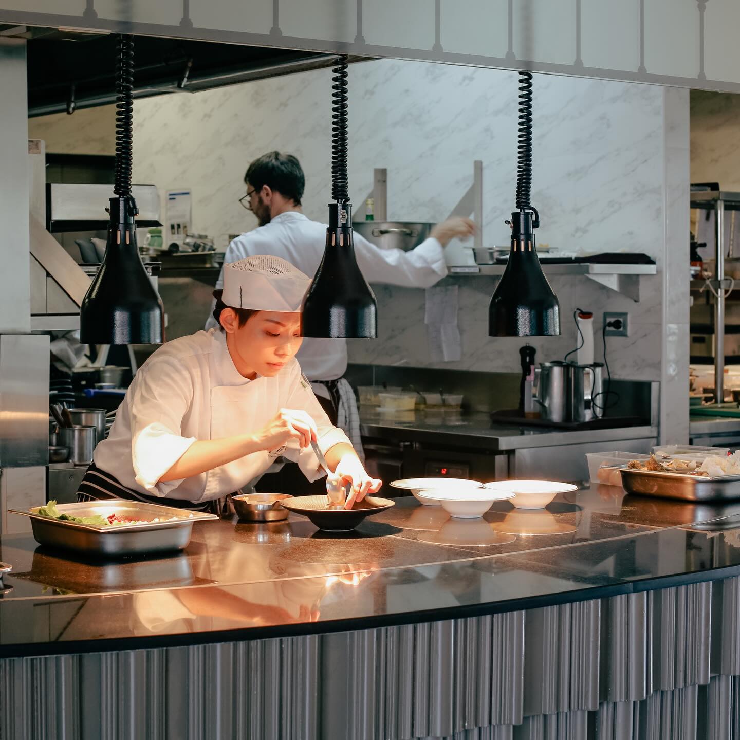 Some restaurants serve dinner. Some like J’AIME by Jean-Michel Lorain shape a life.
After 11 years, the restaurant is closing April 1st and there’s so much to say what this place has meant to me.
This was the first restaurant I entered as a young professional after graduating from Le Cordon Bleu. I came in as an intern, eager, nervous, still finding my footing, and was lucky enough to learn under Head Chef Amerigo Sesti in a place that believed excellence and kindness could live in the same room.
Over the years, J’AIME became far more than a restaurant to me. It became a place of growth, trust, laughter, celebration, and deep friendship. Some of these photos hold little chapters of that story: big events worked side by side, birthdays celebrated, the wonderfully polarizing upside down piano, and a collaboration at Off Menu by Tatler that brought us together again in a full circle kind of way.
What stays with me most is not only the food, though the food was always thoughtful and beautiful. It was the people. The generosity. The openness. The willingness to nurture young talent, to share, to collaborate, to make others feel they belonged.
And when Covid hit, J’AIME wasn’t just a fine dining restaurant. Chefs Amerigo, Yoan Martin and Marine Lorain were instrumental in helping Kelvin , me, and Happivore begin the work of feeding Bangkok’s food-insecure communities, something that continues to this day. And even when Chef Jean-Michel Lorain himself flew in from France, he joined in too. That generosity meant everything to me.
For all the conversation around what can go wrong in this industry, J’AIME was always a gem to me for what went right: integrity, warmth, openness, beautiful food, and truly good people.
It is deeply sad to see this chapter close. But I will always be grateful it was part of my story.
Thank you, Chef Lorain and Marine. Thank you, Chefs Amerigo and Yoan. Thank you to everyone who made J’AIME what it was.
Your doors may be closing, but your place in my heart, will not.
@jaime_bangkok @amerigo.sesti @yoan.martin14 @lorainmarine