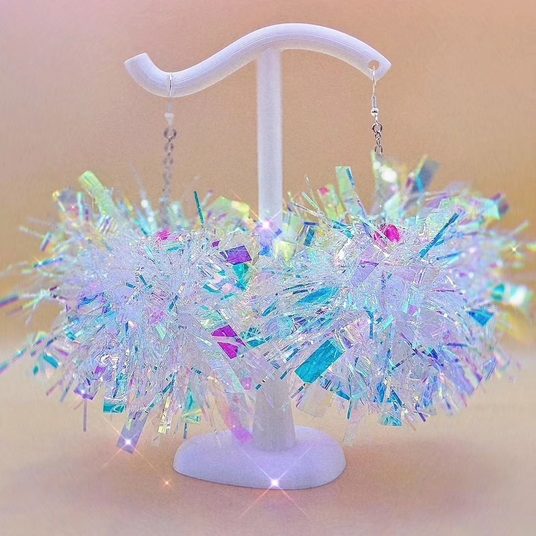 Did you miss the aurora borealis last night? Well don't worry pals, because we've got some handmade pompom earrings that are DRIPPING in aurora borealis sparkle! ✨️🩷💜🩵💚
These beaut babes are like little mini disco balls because when they catch the light, rainbows just dance off them! 🌈🪩 who doesn't want a mini party hanging of their ears? 😉✨️
I'm working suuuuuuper hard behind the scenes at the moment, getting the website up and running 💻 working on some new products, and catching up on Stick Snuggie orders... because I love to overwhelm myself with work 🤭🤪 so keep your peepers peeled!