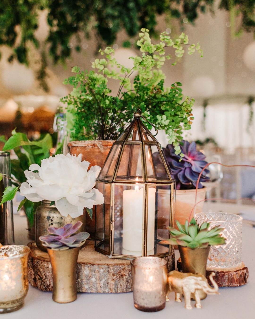 The simplicity of stacking wood, potted plants and then adding some mix match votives for added interest and finishing with some personal details in the form of the little gold animals. Simple to put together but so effective.
Lovely image by @peppermintlove_ at @parley_manor a number of years ago.
#tablestyling #weddingprophire #plantsandcandles