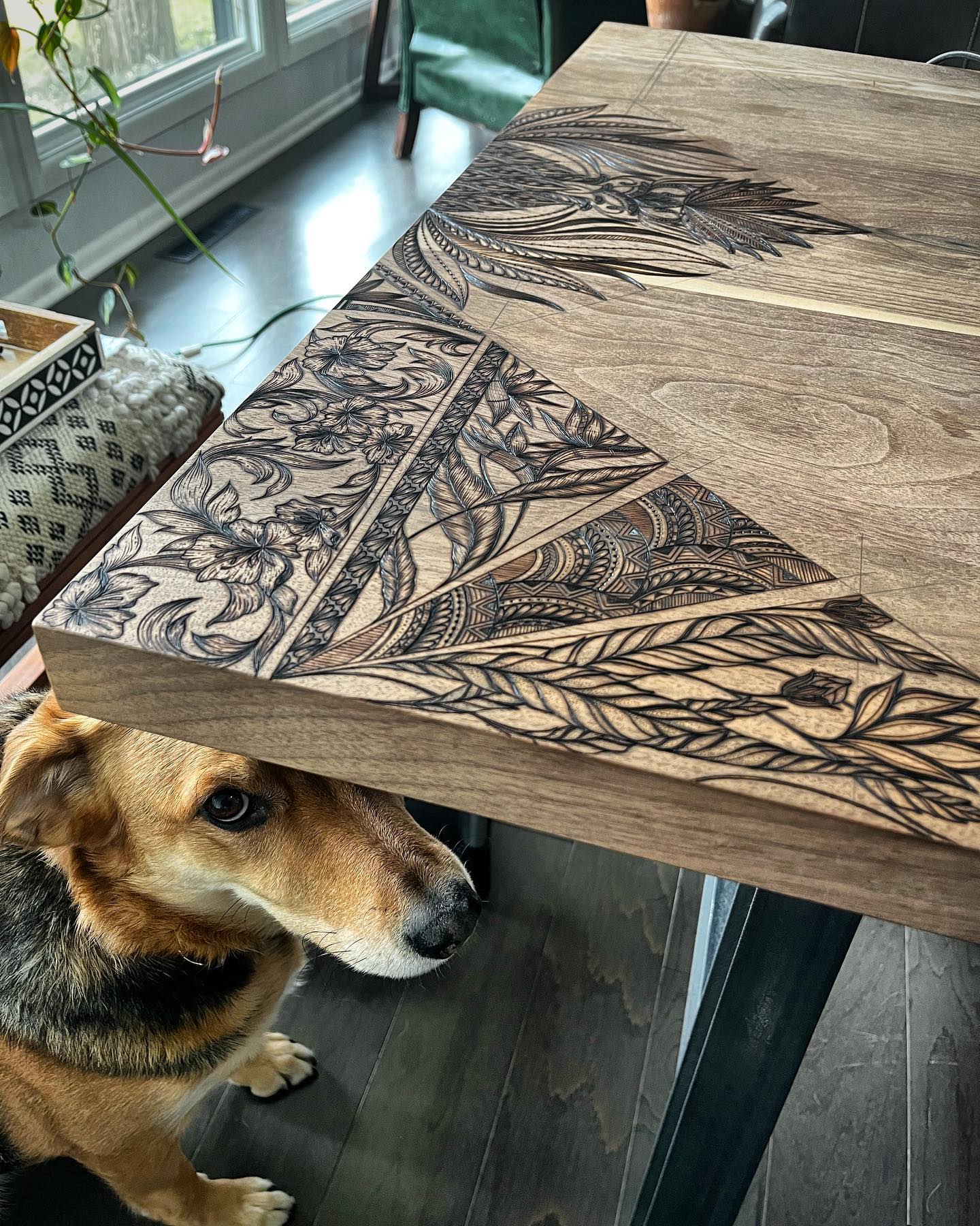 My loyal steed wondering when I’m going to stop burning the table so we can play 😝 Swipe for this week’s progress, officially finished one full corner! This is what 29 hrs of pyrography looks like 🔥
.
.
.
.
.
.
#kcapurasdesign #pyrography #pyrographyart #pyrographyartist #woodart #woodartist #woodburning #woodburningartist #woodburningart #woodporn #burnedbyhand #freehand #pineapple #botanicalart #woodcraft #originaldesign #oneofakind #femalewoodworker #naturalstyle #homedecor #boho #bohohome #statementpiece #diningtable #customfurniture #artofinstagram #process #michigan #localartist @razertip