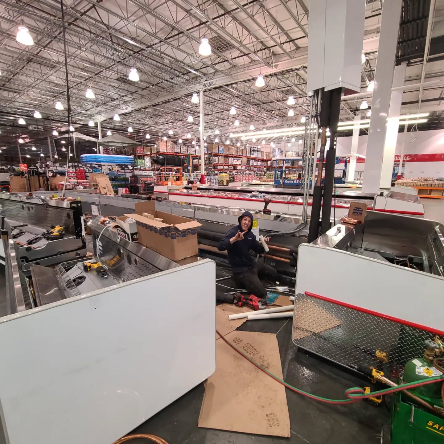 Overnight island refrigerated cases installation. Glycol chilled water heat exchange. Our finest and brightest shown here!