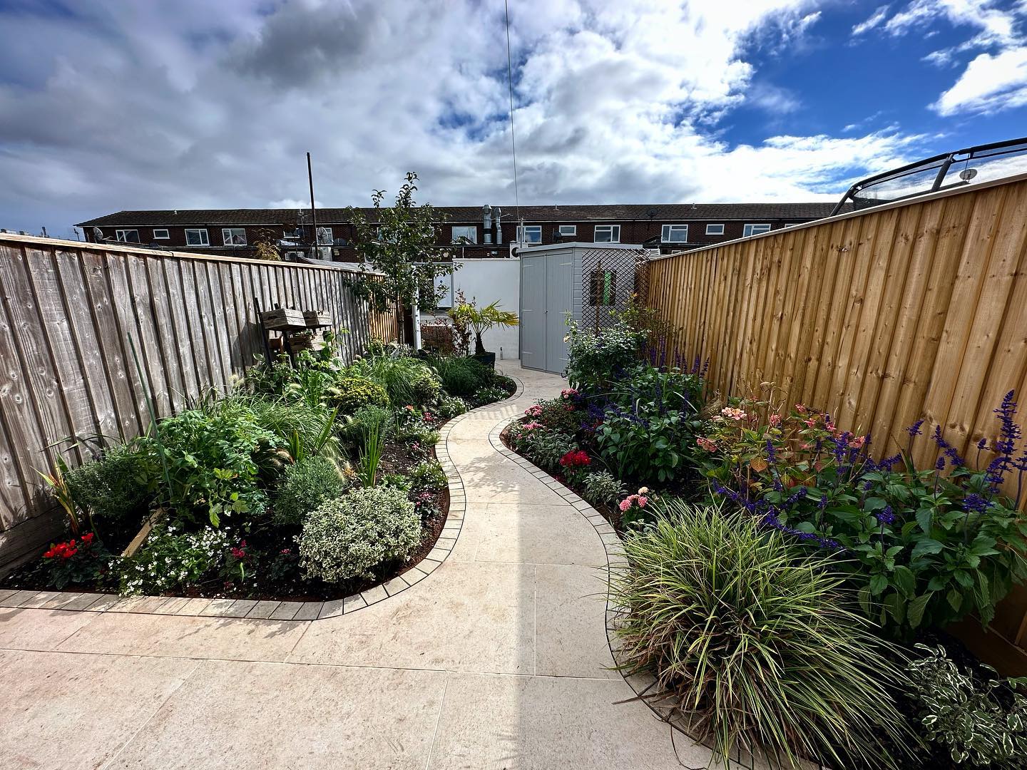 Back to a project in Exeter to add edging to this terrace we completed earlier in the year. Previously we ripped out the lawn, raised beds and old patio and replaced using @mandarinstoneofficial porcelain. Having a central, meandering pathway with lots of planting either side creates a much more immersive space, providing different pockets of interest as you make your way to the bottom of the garden. A real transformation for a small garden. #landscaping #landcapedesign #garden #gardendesign #exeter #chagford #devon
