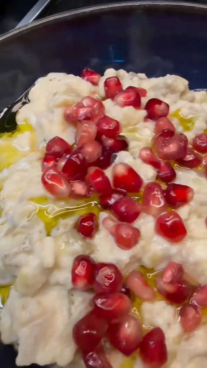 Moutabal ⬇️⬇️⬇️
RECIPE BELOW
Ingredients
• 2 aubergines
• Juice of ½ lemon
• 1 teaspoon salt
• 4 tablespoons tahini
• 4 tablespoons yoghurt
• 2 garlic cloves, crushed
Garnish
• Olive oil
• Pomegranate seeds
Instructions:
Prick several holes in the aubergines to prevent them from bursting during cooking.
Grill the aubergines over an open flame or under the oven grill until the skin is fully charred and the flesh is soft. This gives the Moutabal its characteristic smoky flavour.
Remove from the heat, cover with aluminium foil, and allow to rest for 5 minutes.
In a bowl, whisk together the tahini, lemon juice, crushed garlic, yoghurt, and salt until smooth and creamy. Set aside.
Scoop out the aubergine flesh, roughly chop it, and allow it to cool slightly.
Fold the aubergine into the tahini mixture and mix until well combined.
Transfer to a serving bowl and garnish with a drizzle of olive oil and pomegranate seeds. #middleeasterncuisine #auberginerecipes #moutabal #mezze #foodlover