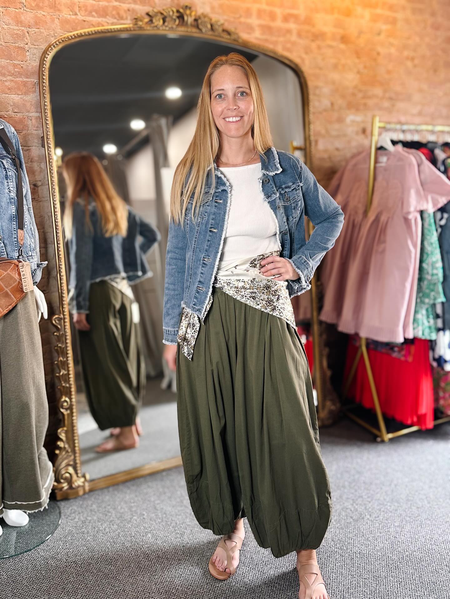 Our outfit of the day features balloon pants, a raw edge denim jacket, new leather sandals, and a silky bandana. 🛍️