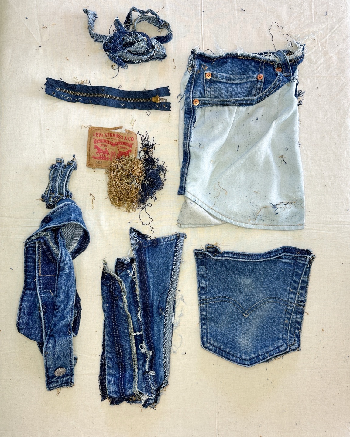 New project, who dis? I don’t always deconstruct jeans to this extent, depends on the project and my time. Sometimes I just cut off the legs and cut them open at the seam.
But other times I like to take everything apart, harvest the thread, open the seams. Because then you get to use the wear patterns created by the faded lights and saturated darks.
You can use the unfurled seams to make stripes and patterns. You can use the shape under the pocket or the lines in the waistband. It’s fun exploration because every pair is a bit different, especially if that pair has been worn and loved.