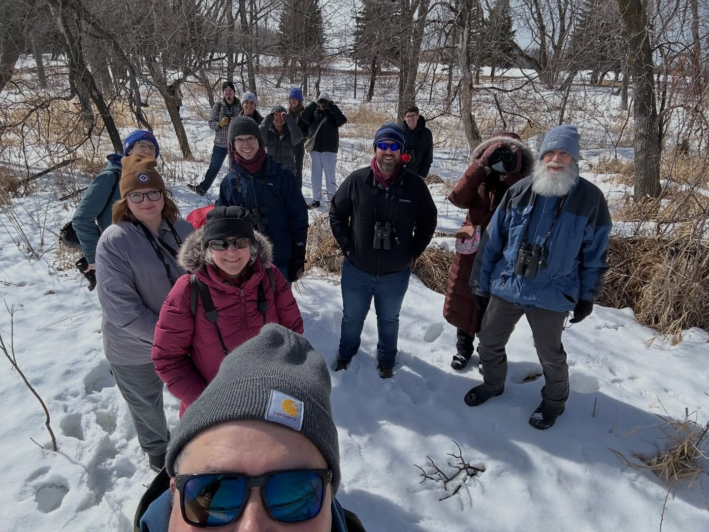 Today on our walk we welcomed back the hundreds of Canada Geese on the river at King’s Park! We were also so fortunate to get really good looks at a Pileated Woodpecker! We saw a total of 14 species, 3 of which were new to our 2026 UMIBC list (Mallard, American Herring Gull, Cackling Goose).
A huge Miigwech to everyone that joined us for the walk. Everyone brings their gifts to the group and our walks would not be the same without each of you. Thank you!
Slide 1: UM Indigenous Birding Club birders posing for group photo in deep snow.
Slide 2: Male Pileated Woodpecker.
Slide 3: UMIBC birders walking in a row.
Slide 4: Male Pileated Woodpecker.
#indigenous
#mentalhealth
#métisbirder
#birdjoyisresistance
#umindigenous