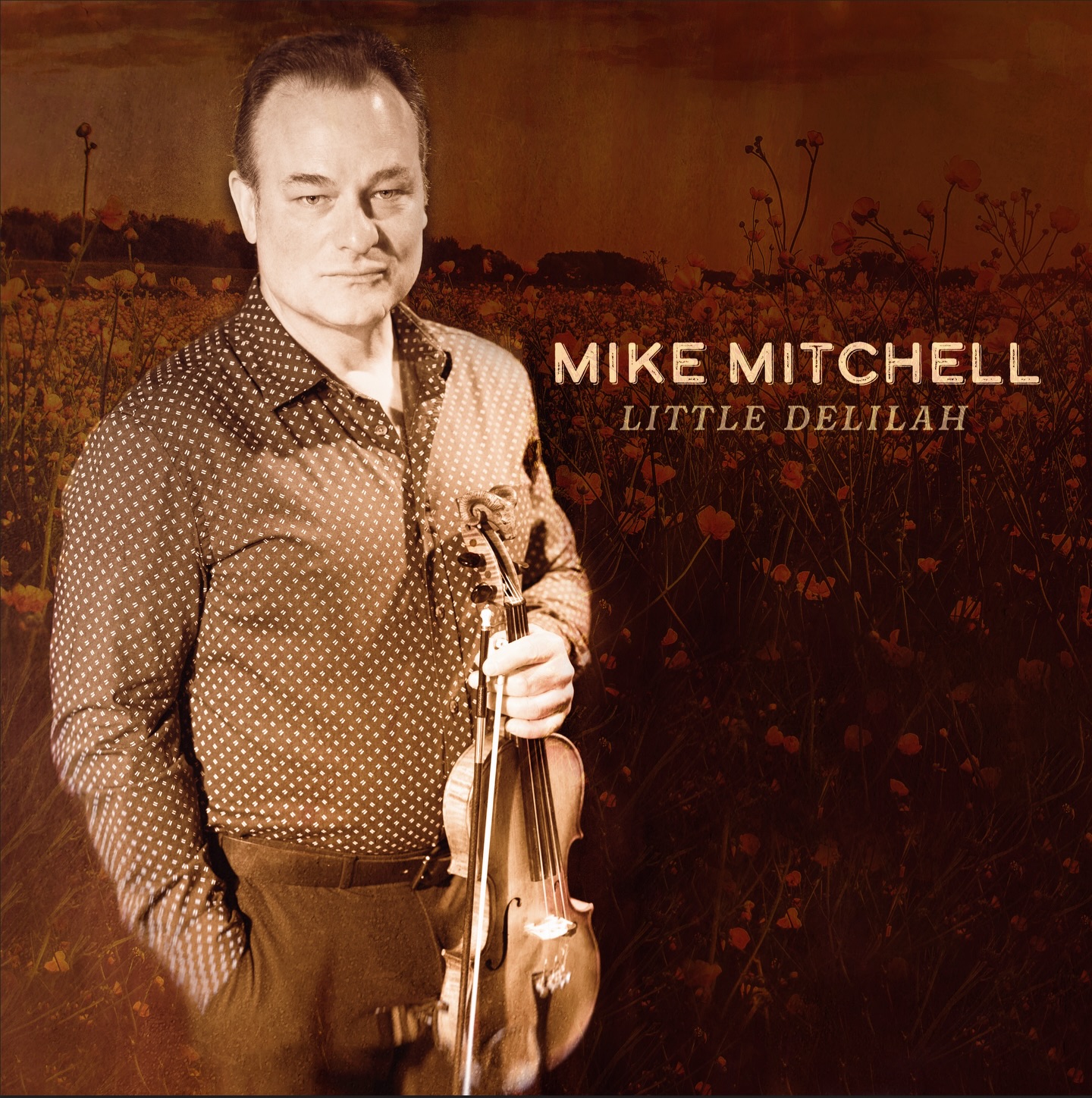 Written by acclaimed songwriters @jonweisberger and @moustachemandolin, the song carries the grit and charm of a classic narrative while delivering the energy and precision that have become hallmarks of Mitchell’s music.
Mike is joined by an all-star lineup of bluegrass talent including @aldridgedarin on guitar (and producer)and harmony vocals, @tim.surrett on bass, @benson_wayneandkristin on mandolin and banjo. Together, the group brings “Little Delilah” to life with a vibrant, authentic sound that blends traditional bluegrass roots with modern drive.
Available on all digital streaming platforms, Little Delilah offers listeners and fans another exciting glimpse into the spirit and sound of “Love Songs, Torch & Bluegrass”, out May 8.
@hoperiverentertainment @jenlbrooke @mountainfevermusic @talktojoey @spotify