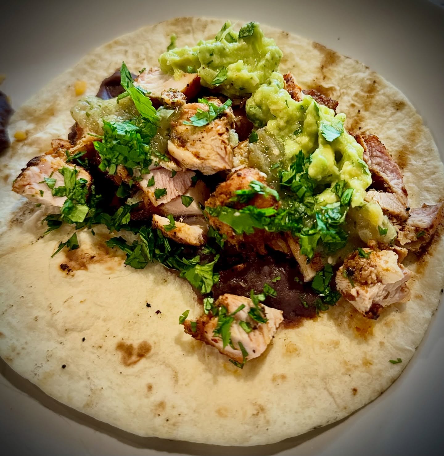 Low key obsessed with these smoked chicken tacos I’ve been making on repeat. Add in some charred homemade salsa verde and guac… unbeatable. #tacos #food #cooking #chickenrecipes #recipes @traegergrills