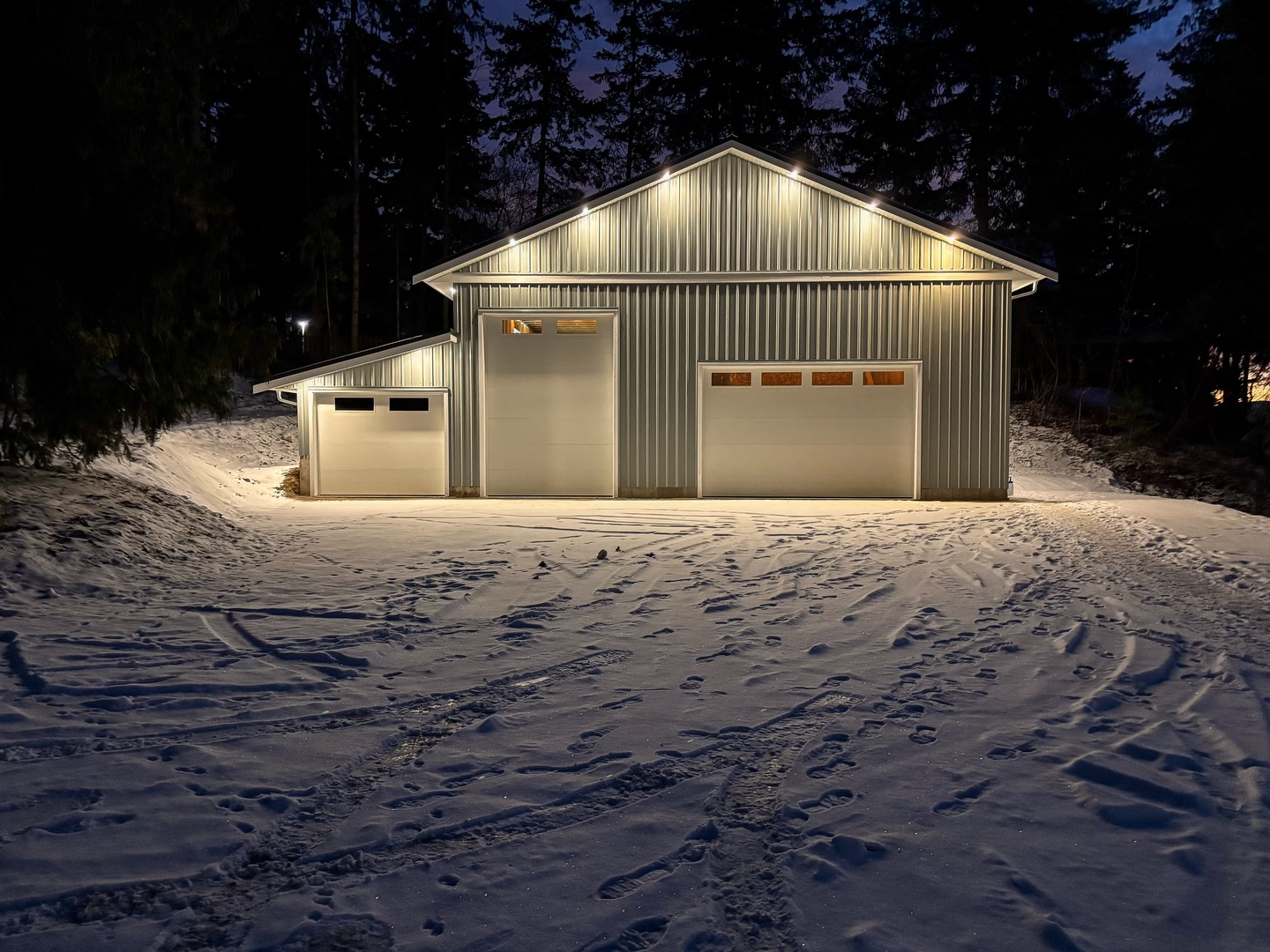 Custom shop built to create a durable and functional workspace. Featuring radiant in-floor heating, exterior perimeter lighting, and a spacious interior layout. #ironrosehomes