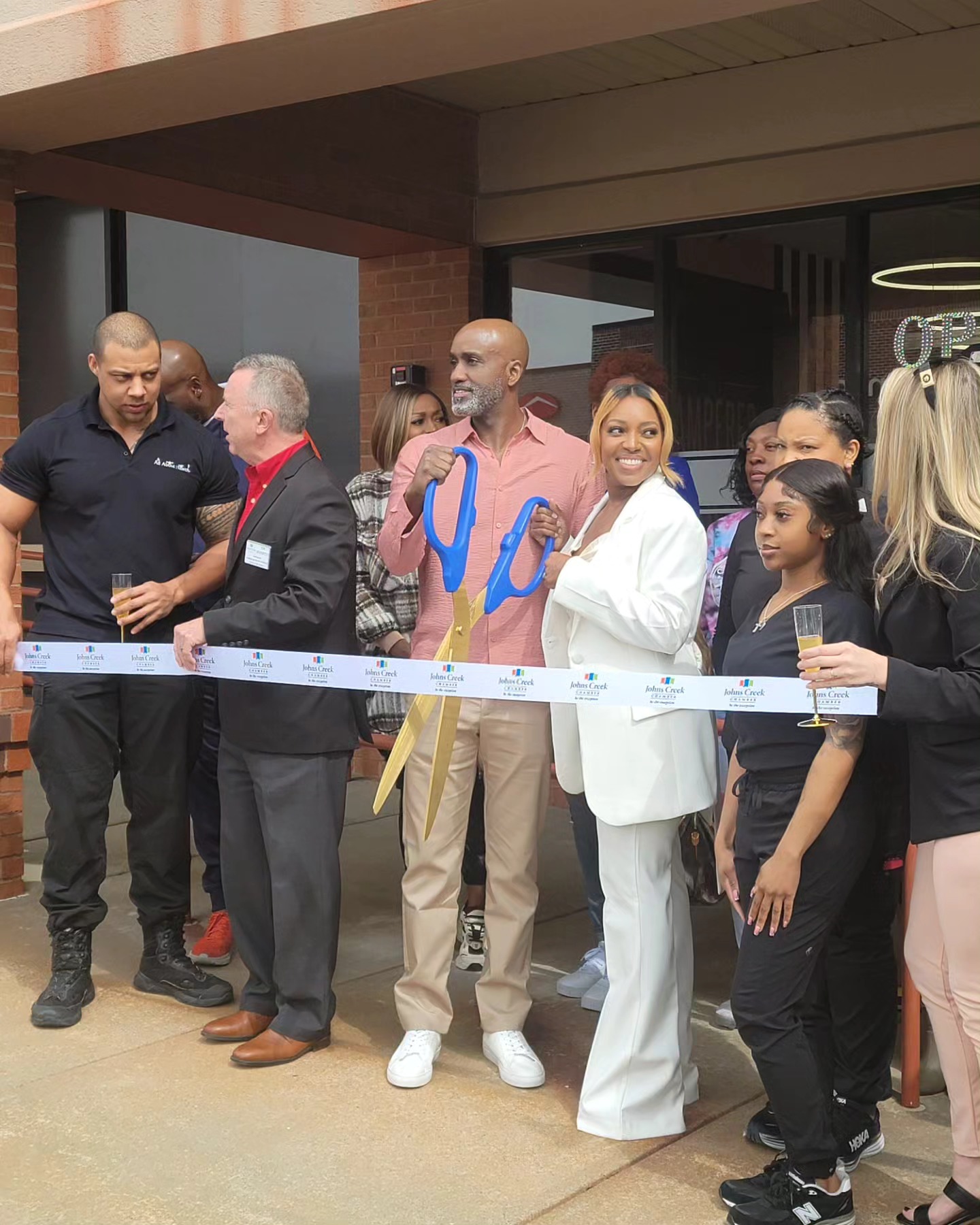 Today I had the pleasure of witnessing the grand opening of the Pampered Peach, John's Creek location 5805 state Bridge rd. This location is ran by the beautiful lady pictured here Stephanie picture with her husband.
This is a lovely salon ready to take care of all your waxing needs.