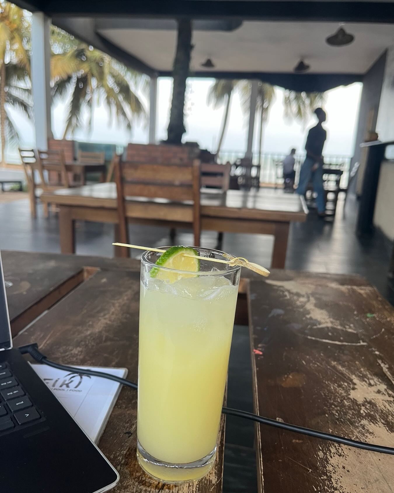 The sun is setting - time for an Afiki special cocktail. Coconut water, Rum, Pineapple, Ginger and Lime. Tasty! Am enjoying my beach side office!!!